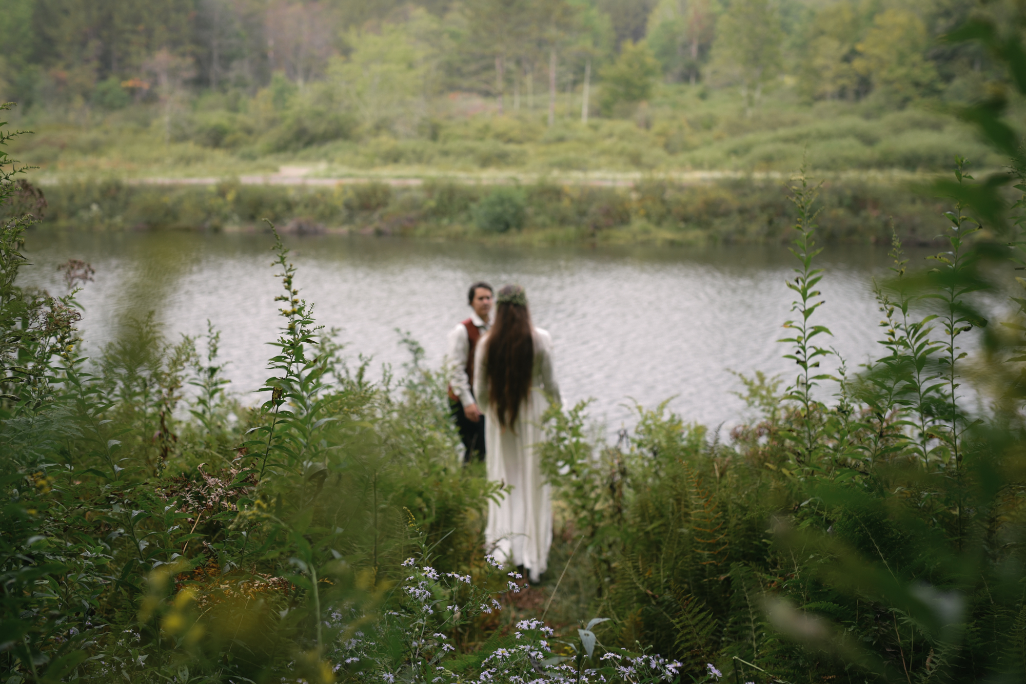  Mountain Wedding, Outdoors, Rustic, West Virginia, Maryland Wedding Photographer, DIY, Casual, candid photo of bride and groom walking in woods towards river, Blackwater River 