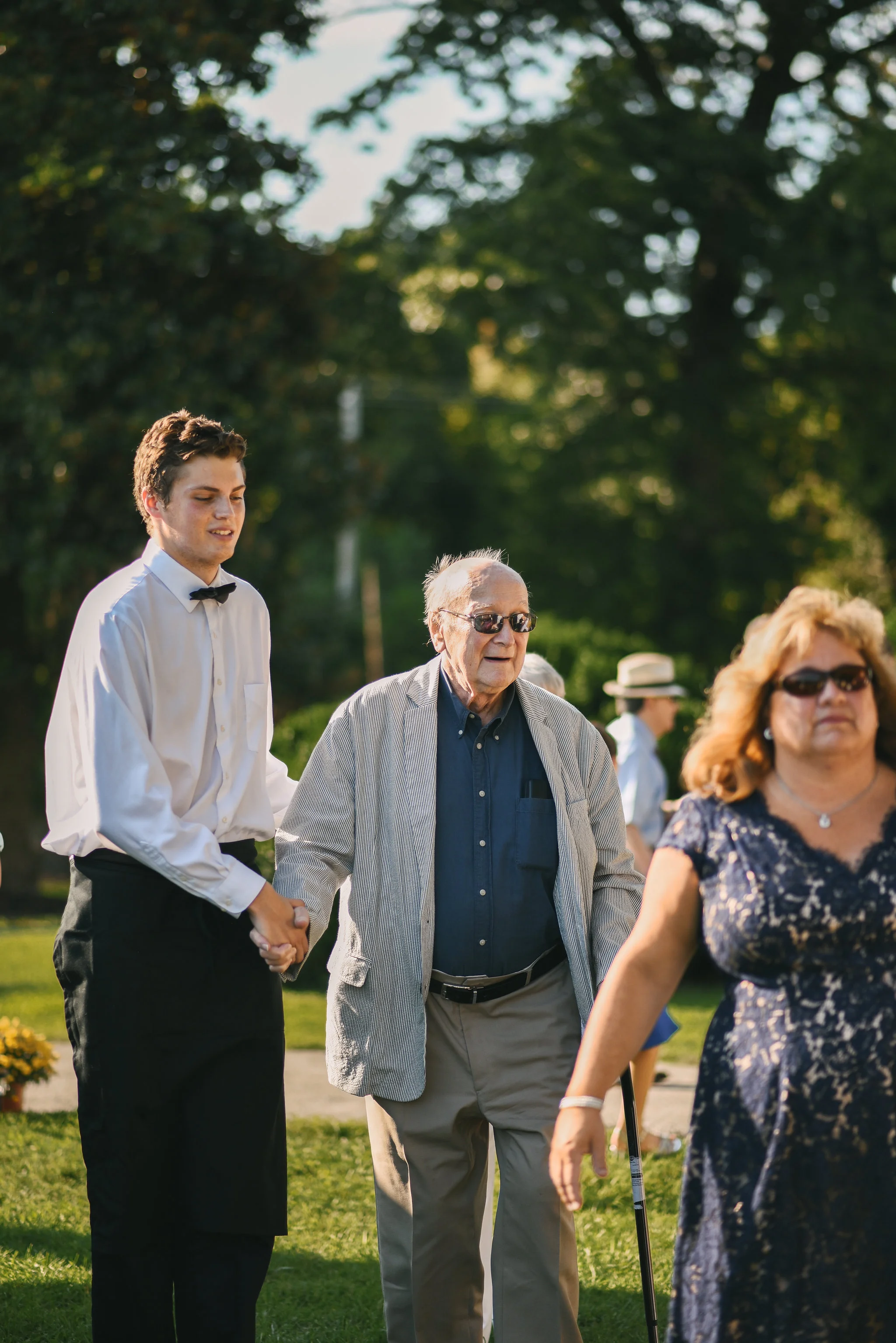 Maryland, Eastern Shore, Baltimore Wedding Photographer, Romantic, Boho, Backyard Wedding, Nature, Family Members Making Their Way to Reception, Guests Walking Outside