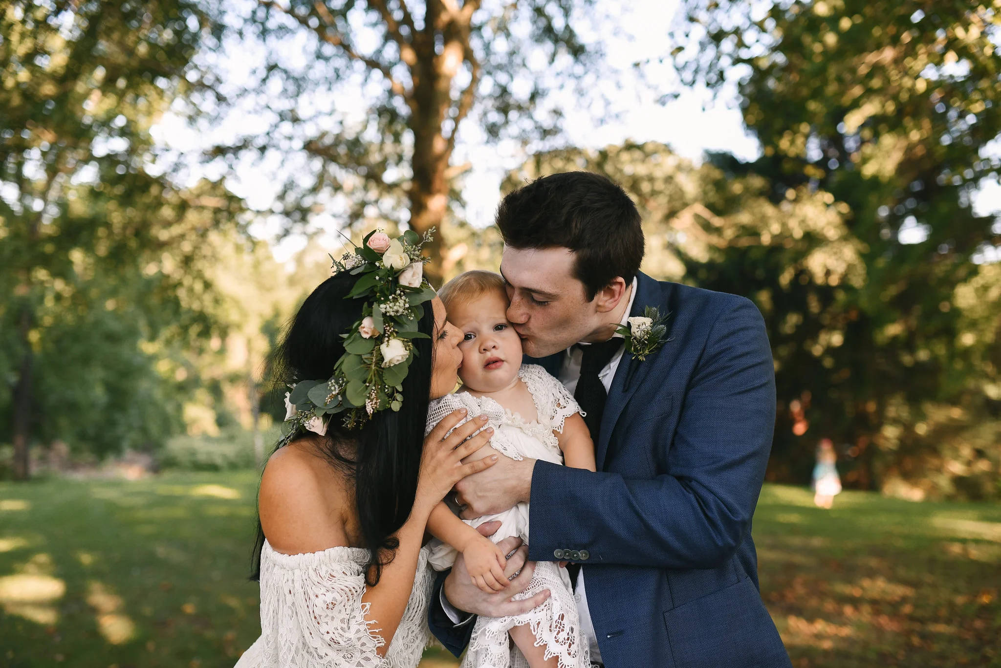 Maryland, Eastern Shore, Baltimore Wedding Photographer, Romantic, Boho, Backyard Wedding, Nature, Bride and Groom Kissing Little Girl, Flower Crown, Michael Designs Florist