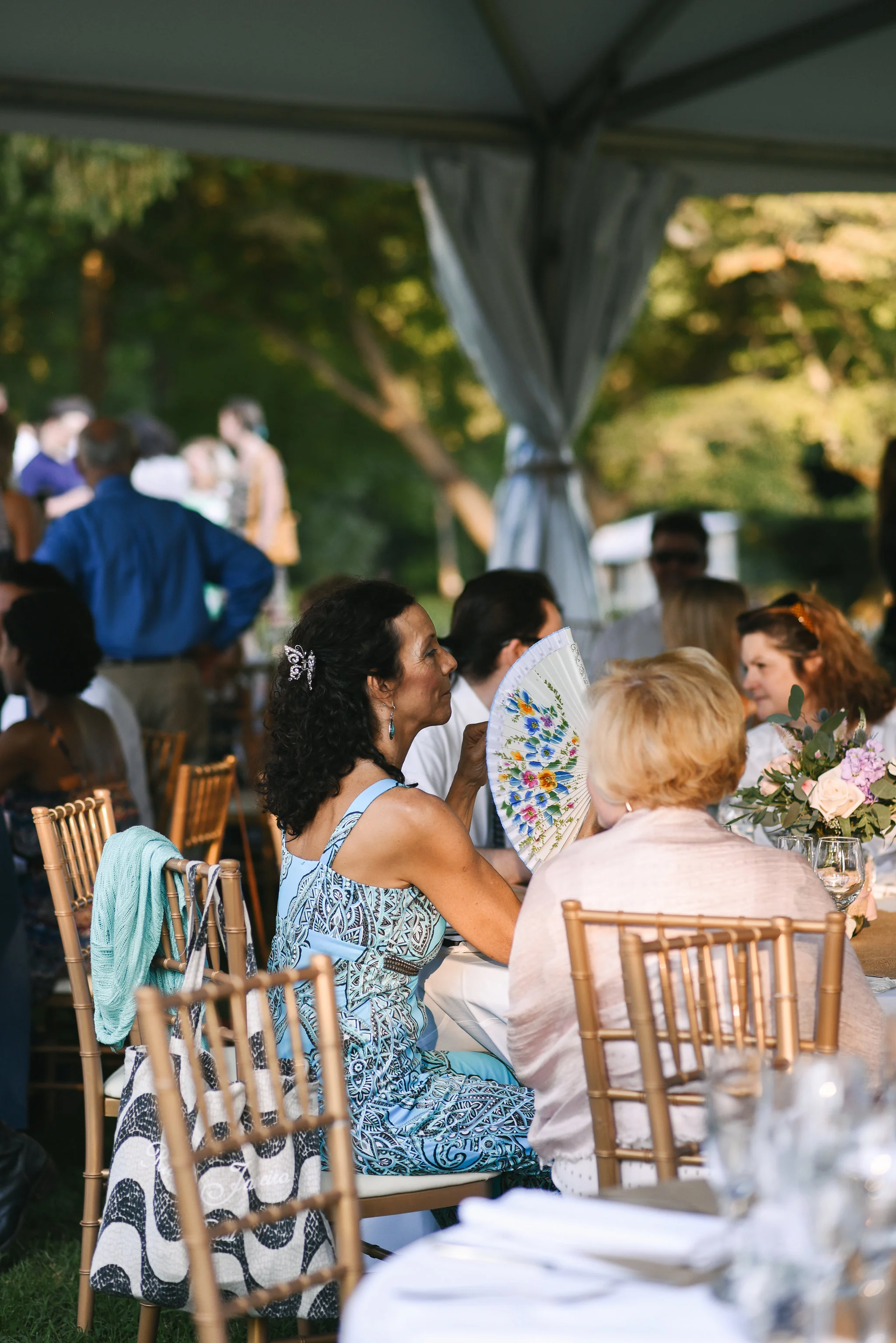 Maryland, Eastern Shore, Baltimore Wedding Photographer, Romantic, Boho, Backyard Wedding, Nature, Wedding Guest Fanning Herself at Reception