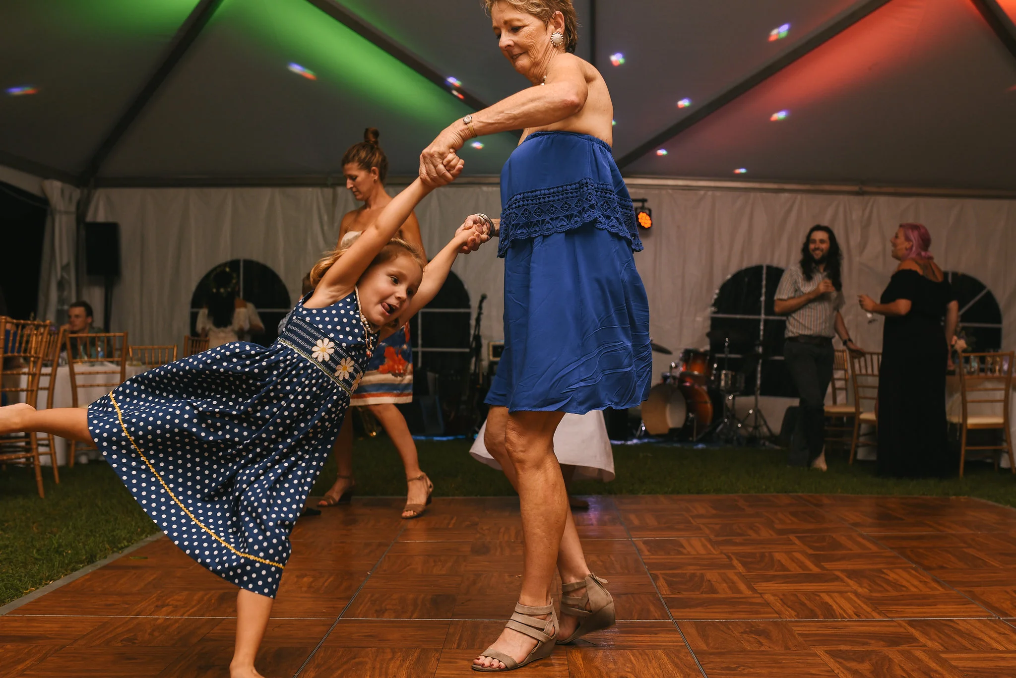 Maryland, Eastern Shore, Baltimore Wedding Photographer, Romantic, Boho, Backyard Wedding, Nature, Wedding Guest Dancing with Little Girl on Dancefloor, Little Girl Spinning