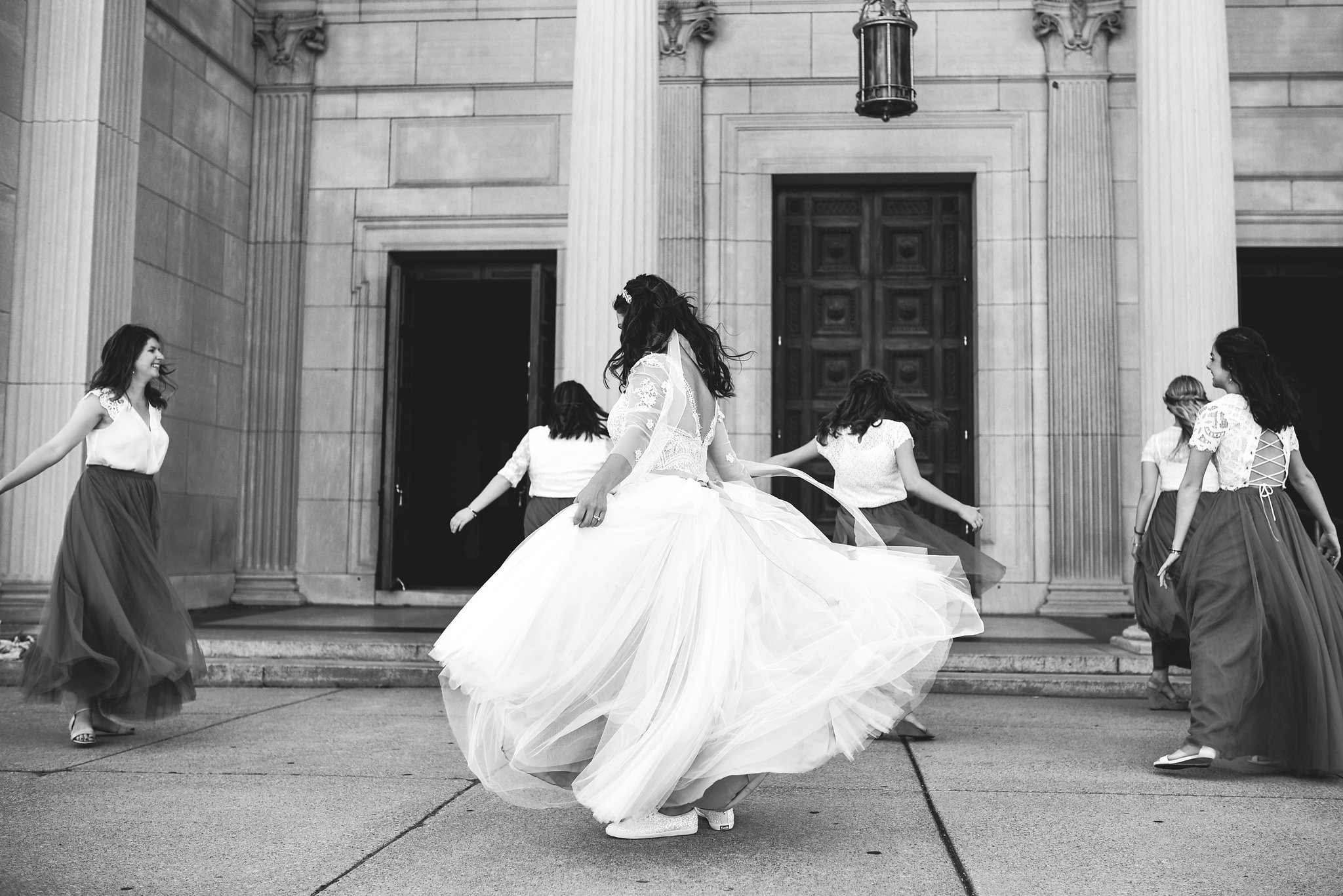  Baltimore, Canton, Church Wedding, Modern, Outdoors, Maryland Wedding Photographer, Romantic, Classic, Black and White Photo, Glittery Sneakers, Lace wedding dress, Bride and bridesmaids dancing on sidewalk 