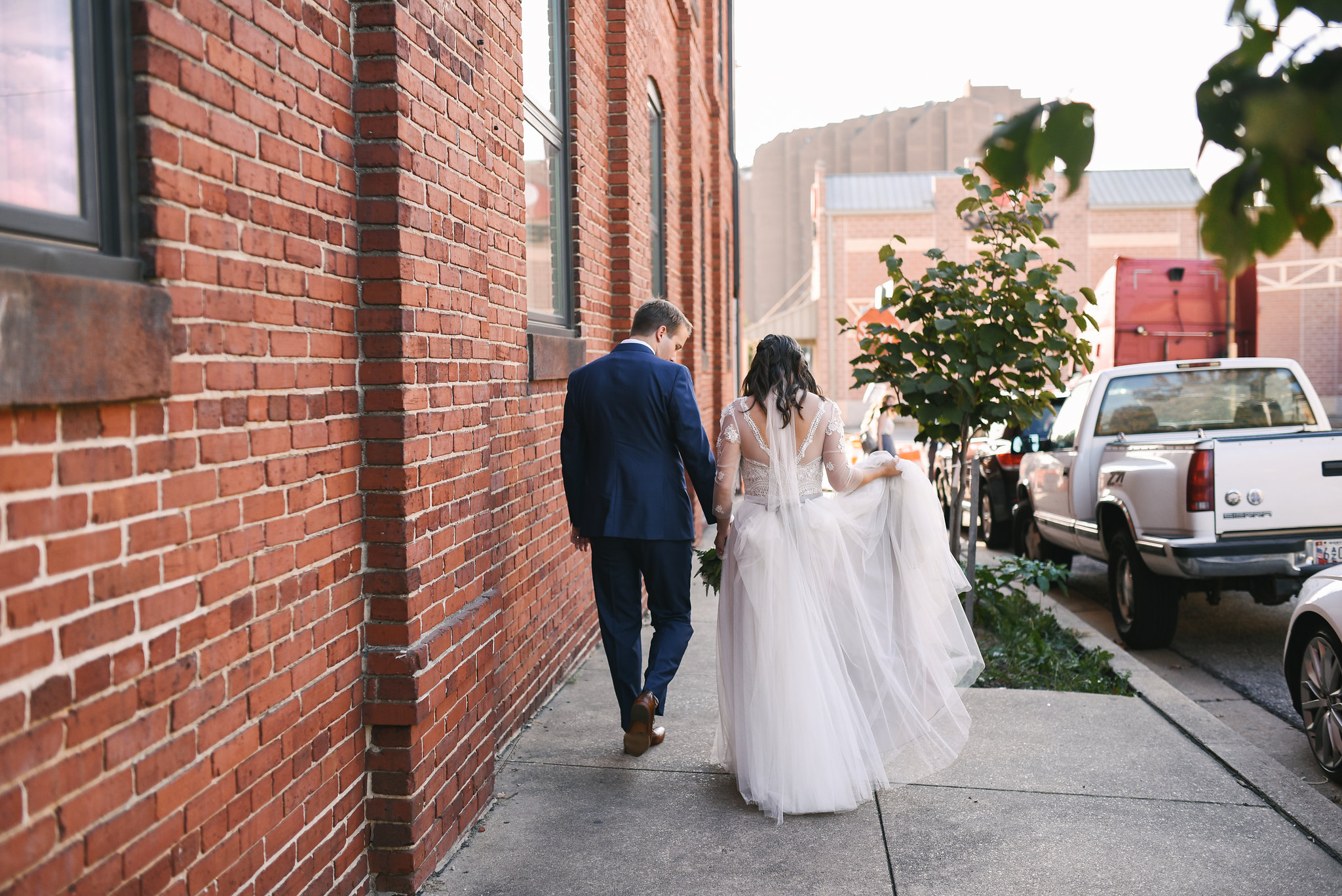  Baltimore, Canton, Church Wedding, Modern, Outdoors, Maryland Wedding Photographer, Romantic, Classic, St. Casimir Church, bride and groom holding hands and walking down sidewalk, downtown, lace dress with sleeves 