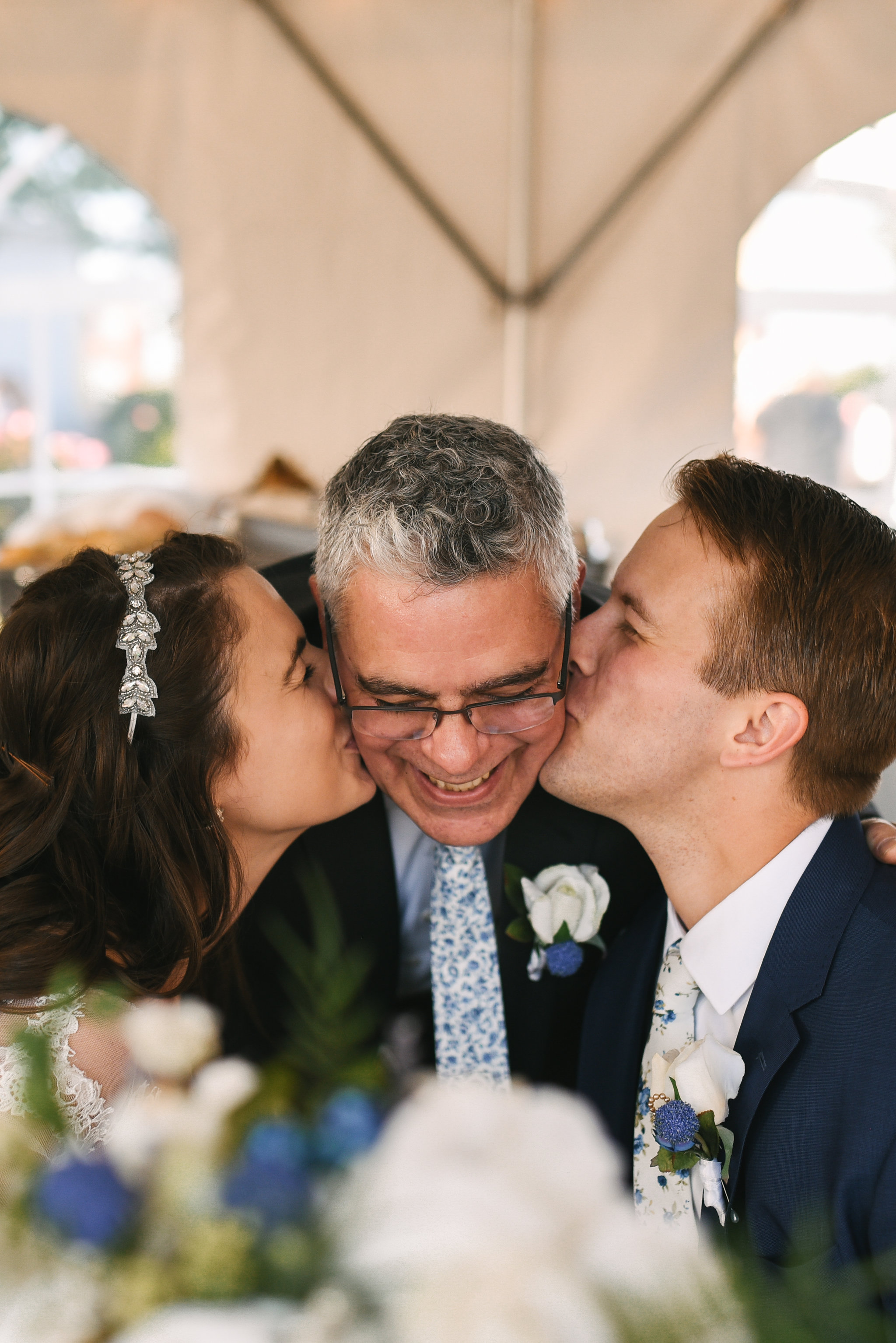  Baltimore, Canton, Modern, Outdoor Reception, Maryland Wedding Photographer, Romantic, Classic, Boston Street Pier Park, Bride and groom kissing father of the bride on the cheek 