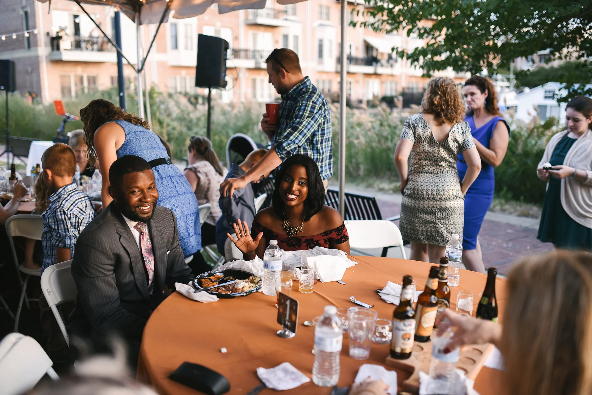 Baltimore, Canton, Modern, Outdoor Reception, Maryland Wedding Photographer, Romantic, Classic, Boston Street Pier Park, Friends smiling seated at Wedding Reception