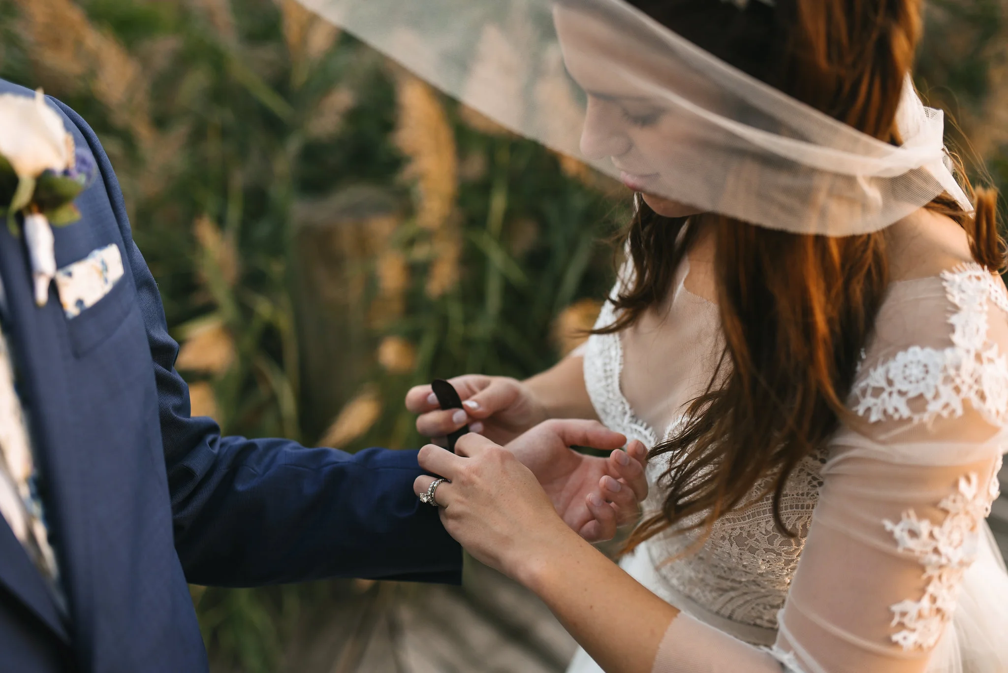 Baltimore, Canton, Church Wedding, Modern, Outdoors, Maryland Wedding Photographer, Romantic, Classic, Lace Wedding Dress, Bride helping groom put on watch