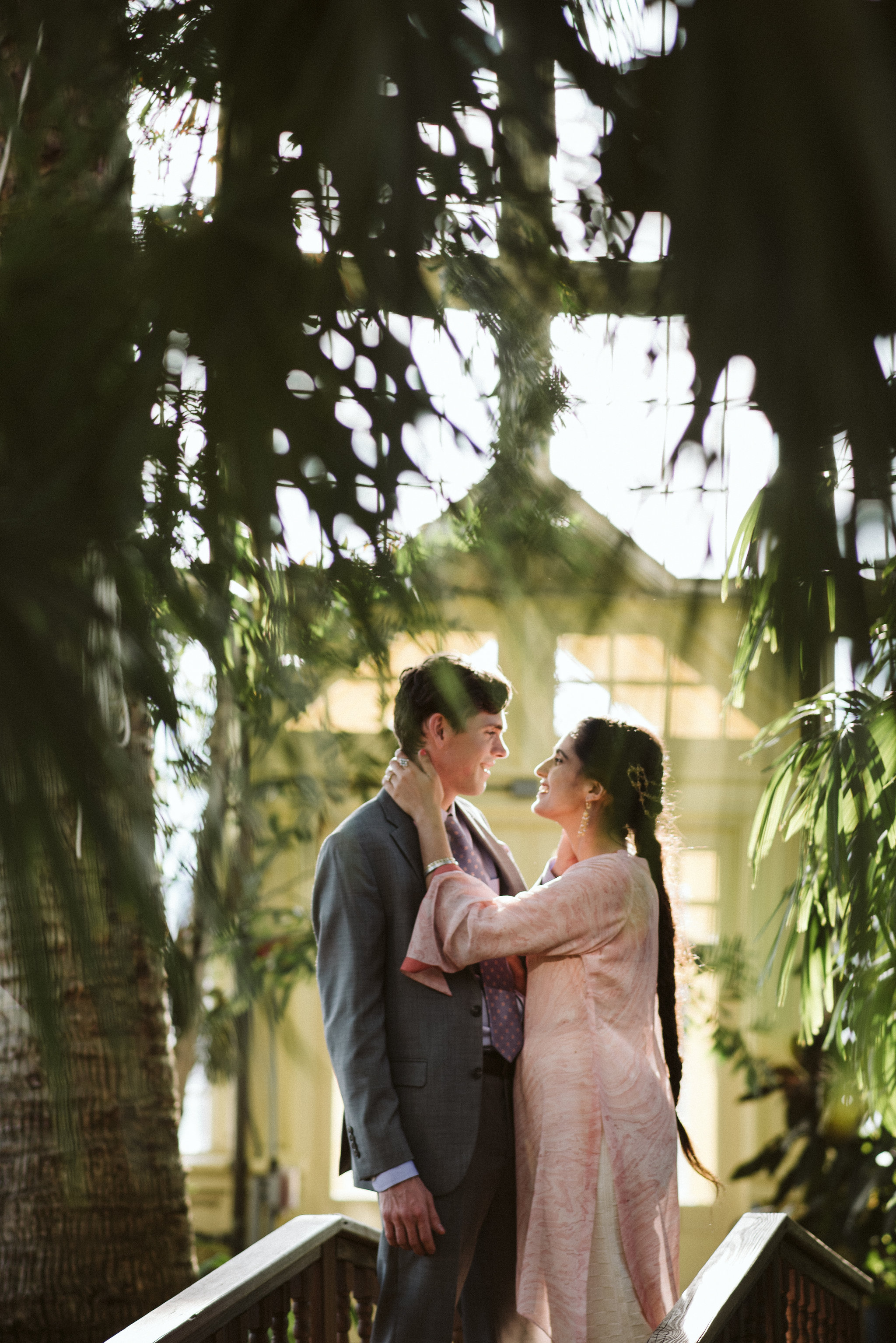 Elopement, Baltimore, Rawlings Conservatory, Greenhouse, Maryland Wedding Photographer, Indian American, Nature, Romantic, Garden, Pink Sari, Braids, Bride and Groom Hugging, Candid Photo