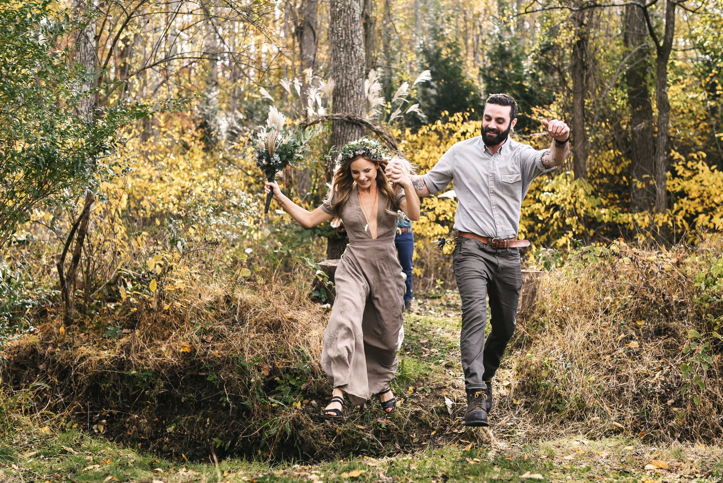  Baltimore, Maryland Wedding Photographer, Backyard Wedding, DIY, Rustic, Casual, Fall Wedding, Woodland, Bride and Groom Jumping Through Field, Just Married, Brightside Boutique Dress 