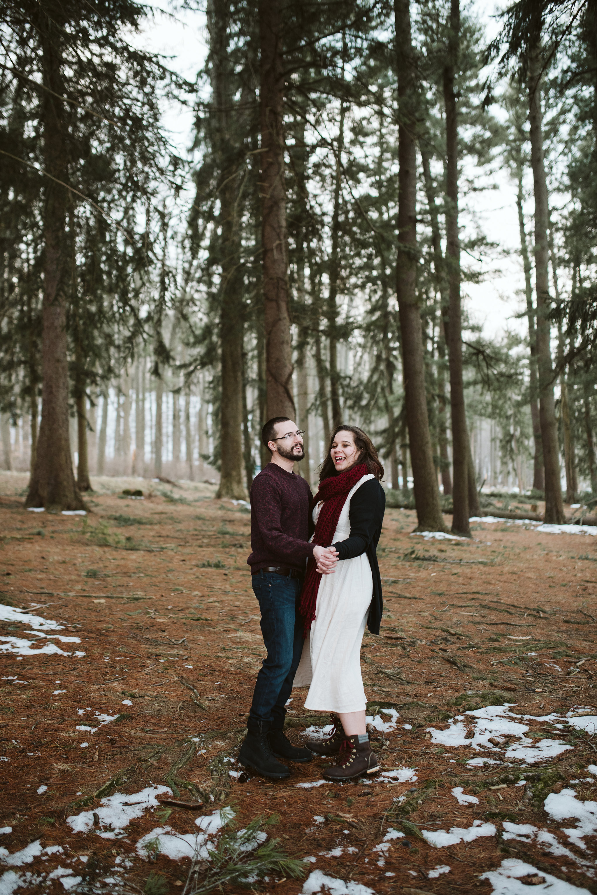  Baltimore County, Loch Raven Reservoir, Maryland Wedding Photographer, Winter, Engagement Photos, Nature, Romantic, Clean and Classic, Couple Dancing Together in the Forest, White Dress with Hiking Boots 