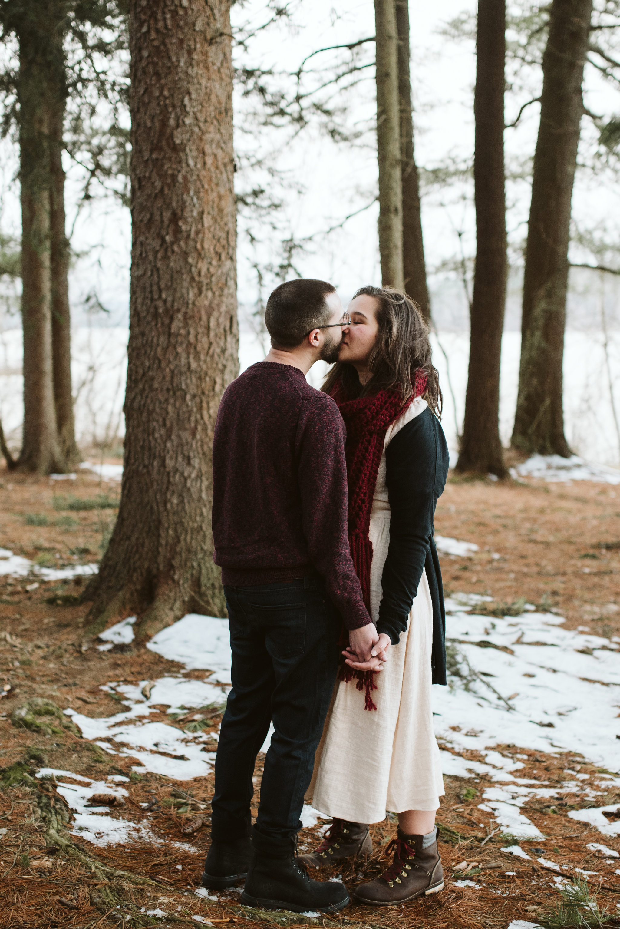  Baltimore County, Loch Raven Reservoir, Maryland Wedding Photographer, Winter, Engagement Photos, Nature, Romantic, Clean and Classic, Bride and Groom Kissing in the Trees, White Dress, Burgundy Sweater 