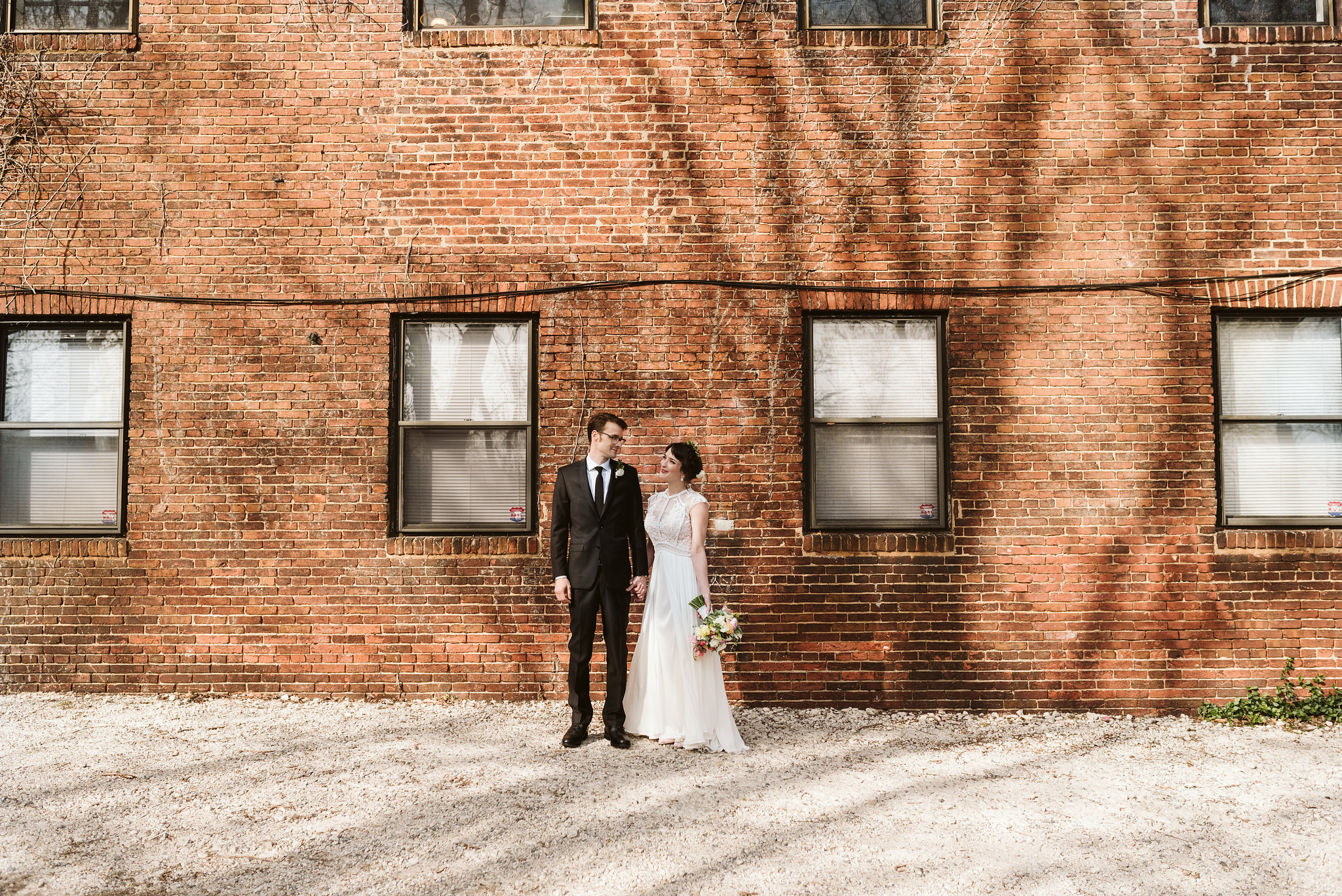  Baltimore, Maryland Wedding Photographer, Hampden, Eco-Friendly, Green, The Elm, Simple and Classic, Vintage, Portrait of Bride and Groom Holding Hands in Front of Brick Wall 