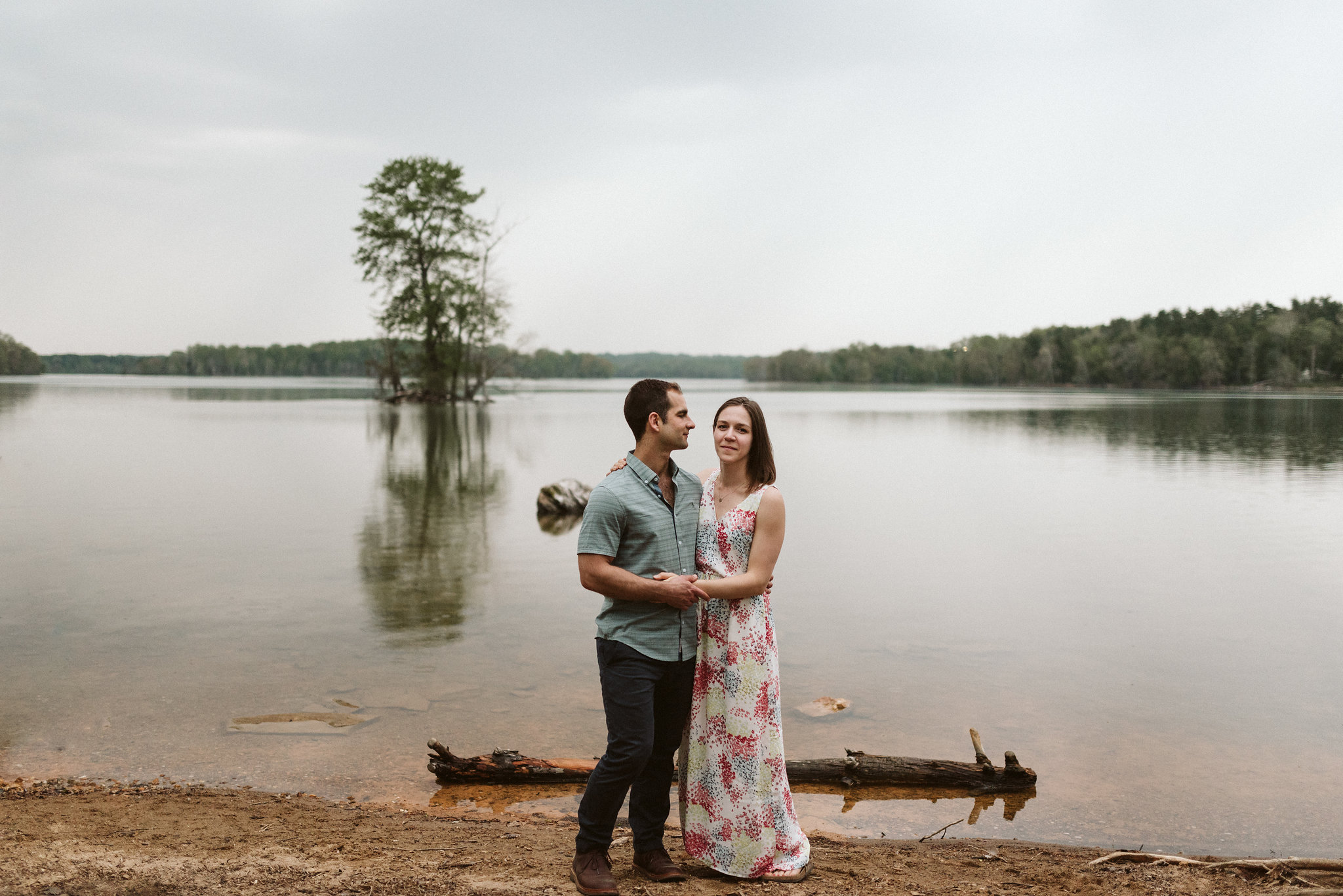 couple dancing in front of lake