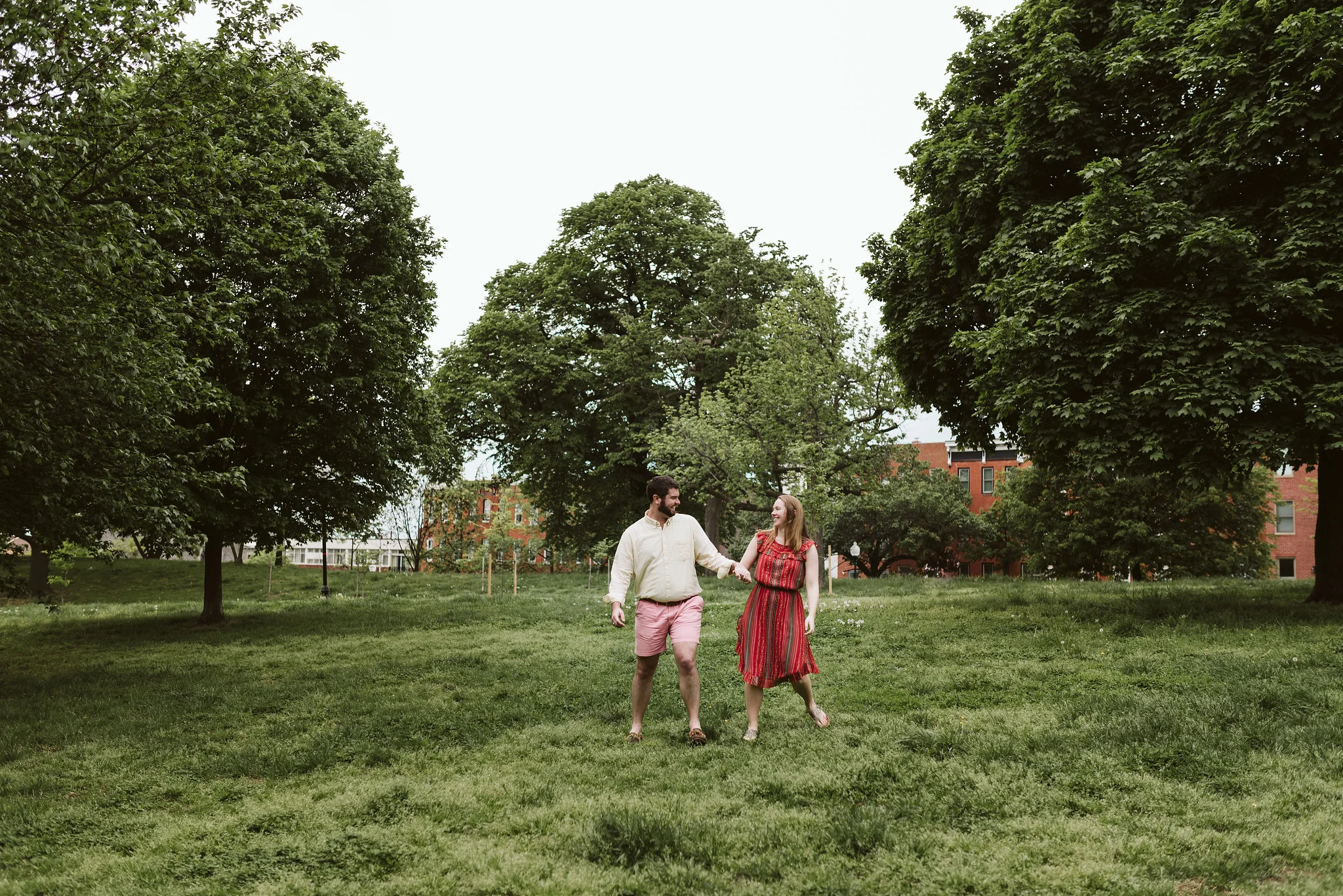 Engagement Photos, Patterson Park, Baltimore, Maryland Wedding Photographer, Casual, Fun, Nature, Couple Playing Together in a Field, Holding Hands