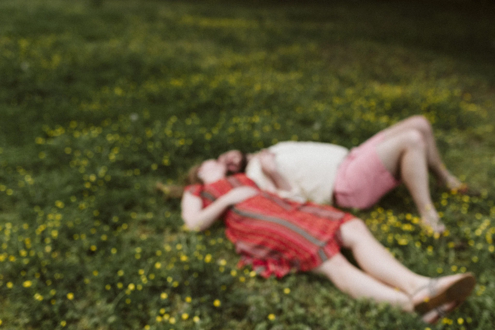 Engagement Photos, Patterson Park, Baltimore, Maryland Wedding Photographer, Casual, Fun, Nature, Couple Laying in a Field Together, Soft Focus