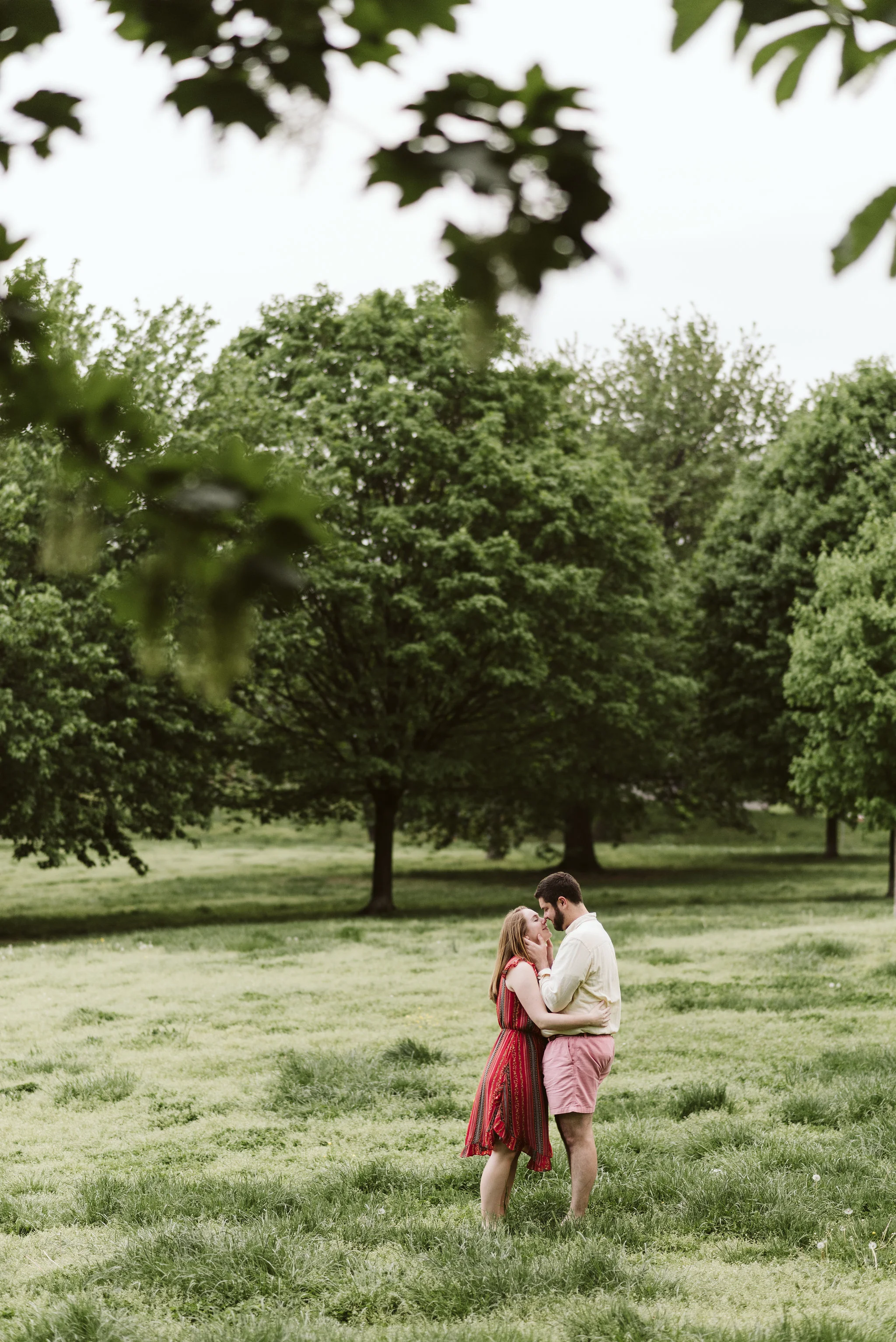 Engagement Photos, Patterson Park, Baltimore, Maryland Wedding Photographer, Casual, Fun, Nature, Bride and Groom Holding Each Other in a Field, Sweet Photo pf Couple