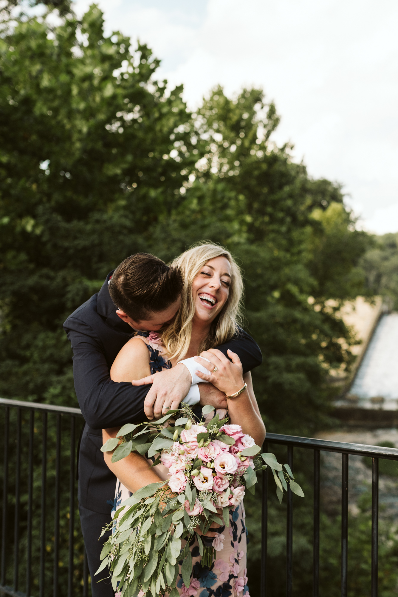 Outdoor Wedding, Casual, Simple, Lake Roland, Baltimore, Maryland Wedding Photographer, Laid Back, DIY Flowers, Bouquet with Eucalyptus and Lisianthus, Bride and Groom Hugging and Laughing