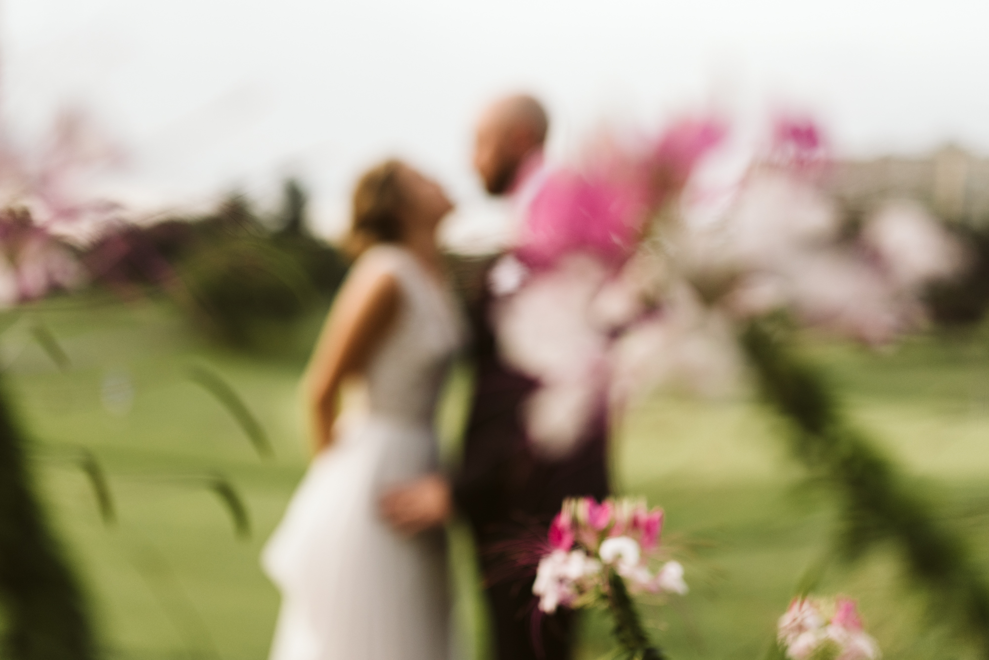 Elegant, Columbia Country Club, Chevy Chase Maryland, Baltimore Wedding Photographer, Bride and Groom Out of Focus with Pink and White Flowers