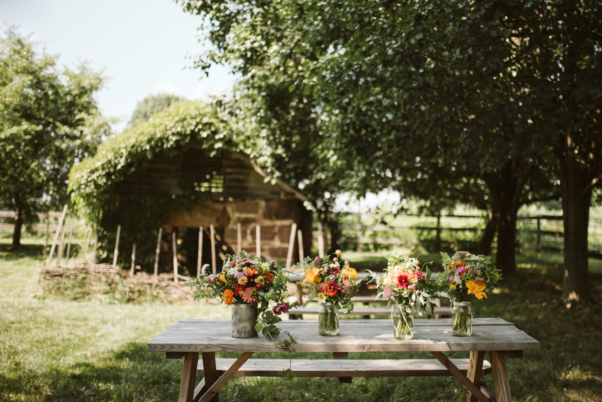 Rocklands Farm, Maryland, Intimate Wedding, Baltimore Wedding Photographer, Sungold Flower Co, Rustic, Romantic, Barn Wedding,  Flower Arrangements in Mason Jars on Picnic Table