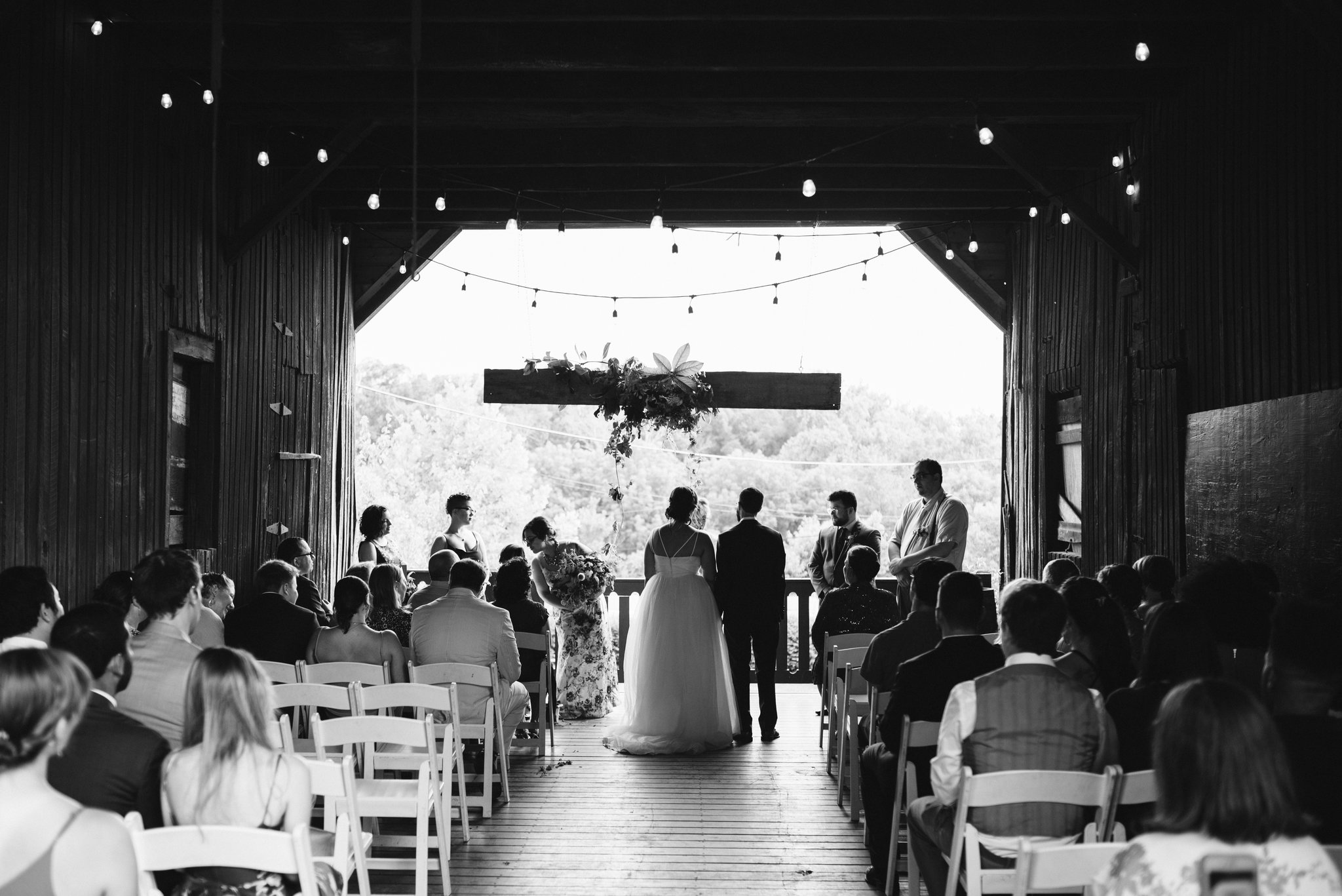 Rocklands Farm, Maryland, Intimate Wedding, Baltimore Wedding Photographer, Sungold Flower Co, Rustic, Romantic, Barn Wedding, Bride and Groom Standing at Altar, Holding Hands, Black and White Photo