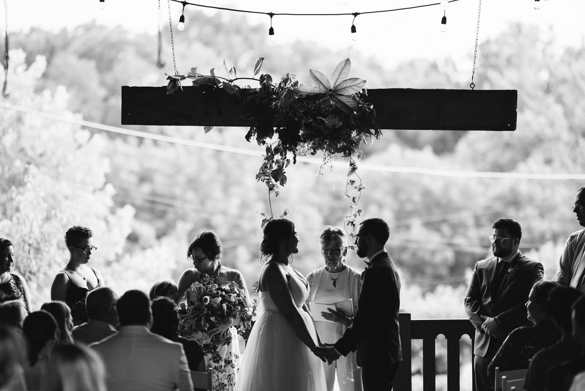 Rocklands Farm, Maryland, Intimate Wedding, Baltimore Wedding Photographer, Rustic, Romantic, Barn Wedding, Bride and Groom Holding Hands in Front of Officiant, Black and White Photo