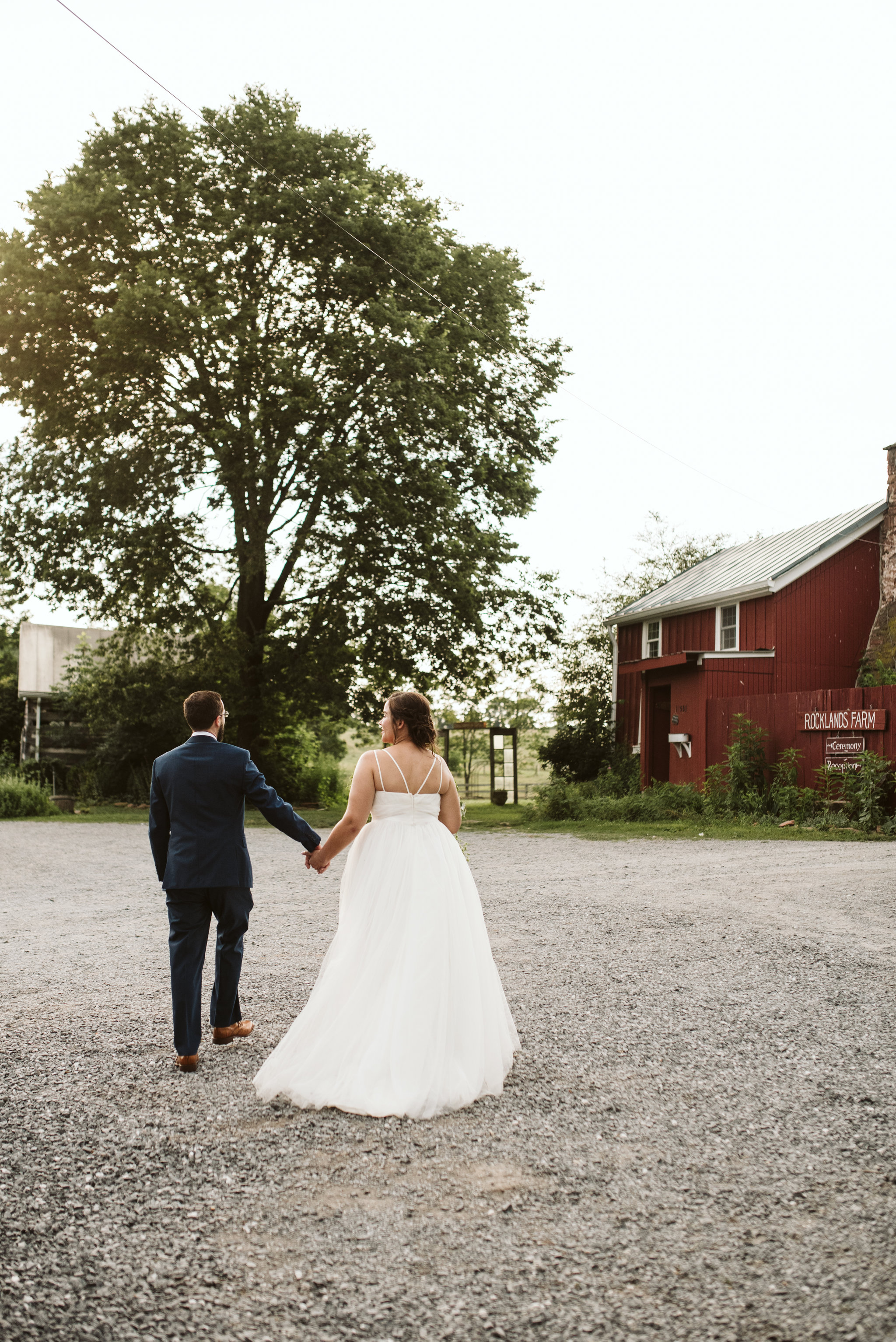 Rocklands Farm, Maryland, Intimate Wedding, Baltimore Wedding Photographer, Sungold Flower Co, Rustic, Romantic, Barn Wedding, Bride and Groom Holding Hands Walking Outside, Just Married
