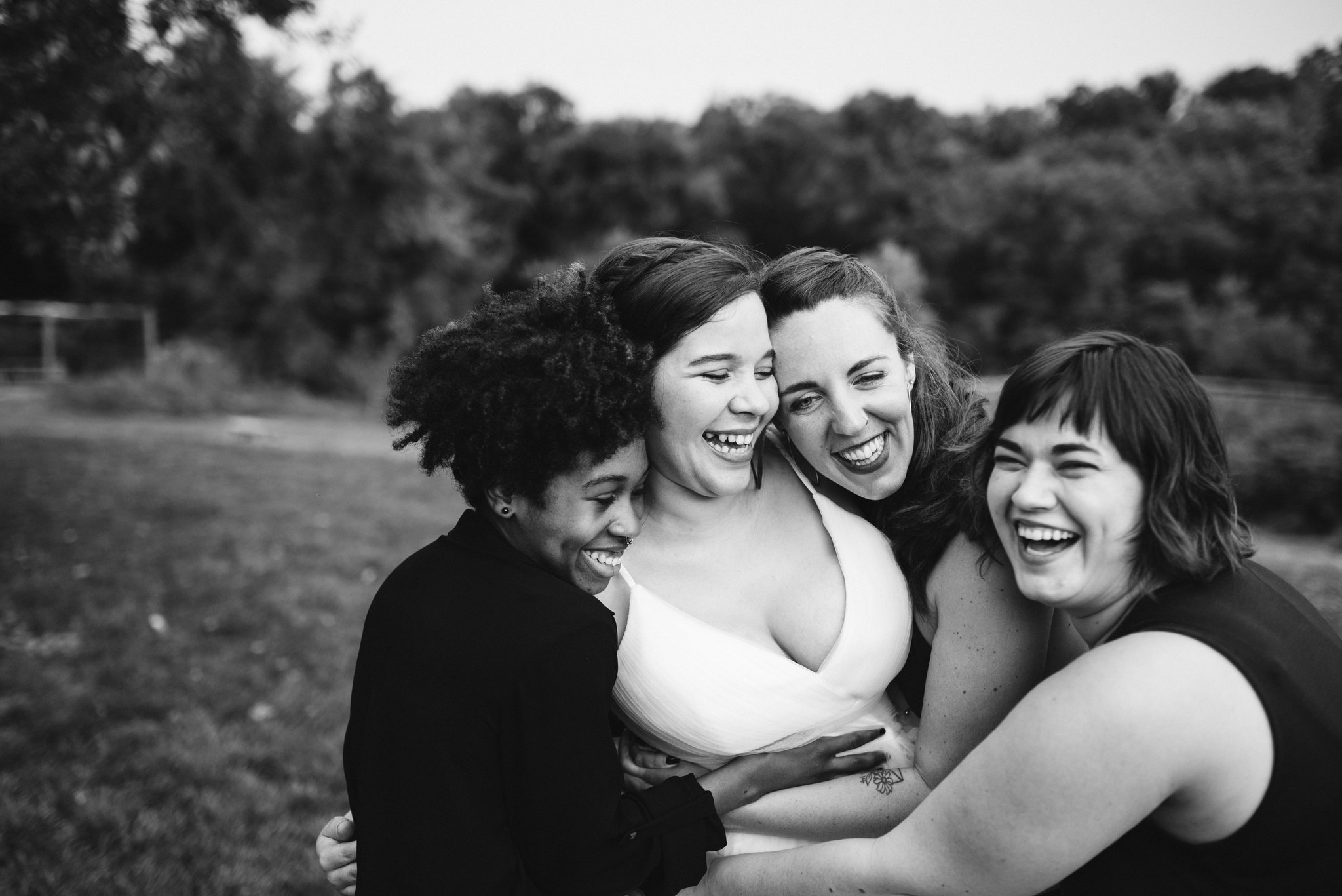 Rocklands Farm, Maryland, Intimate Wedding, Baltimore Wedding Photographer, Sungold Flower Co, Rustic, Romantic, Barn Wedding, Bride Hugging and Laughing with Friends, Black and White Photo