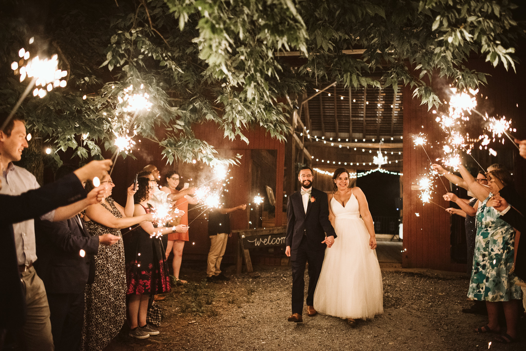 Rocklands Farm, Maryland, Intimate Wedding, Baltimore Wedding Photographer, Sungold Flower Co, Rustic, Romantic, Barn Wedding, Bride and Groom Walking Through Line of Sparklers
