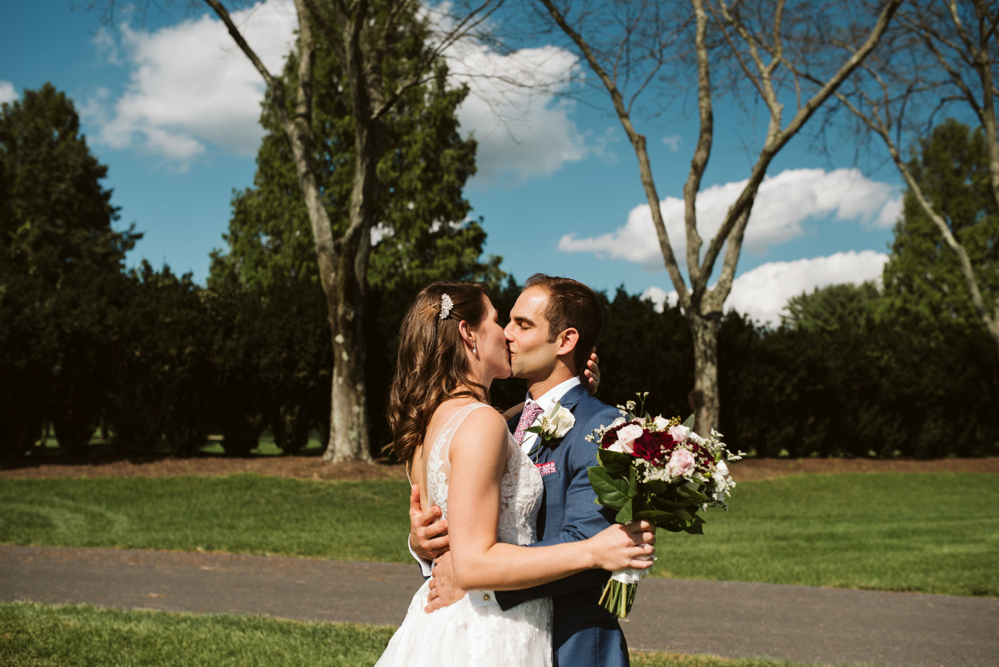  Phoenix Maryland, Baltimore Wedding Photographer, Eagle’s Nest Country Club, Classic, Romantic, Bride and Groom Kissing Outside, Sunshine, Lace BHLDN Dress, Dundalk Florist, Gaby Vinas 