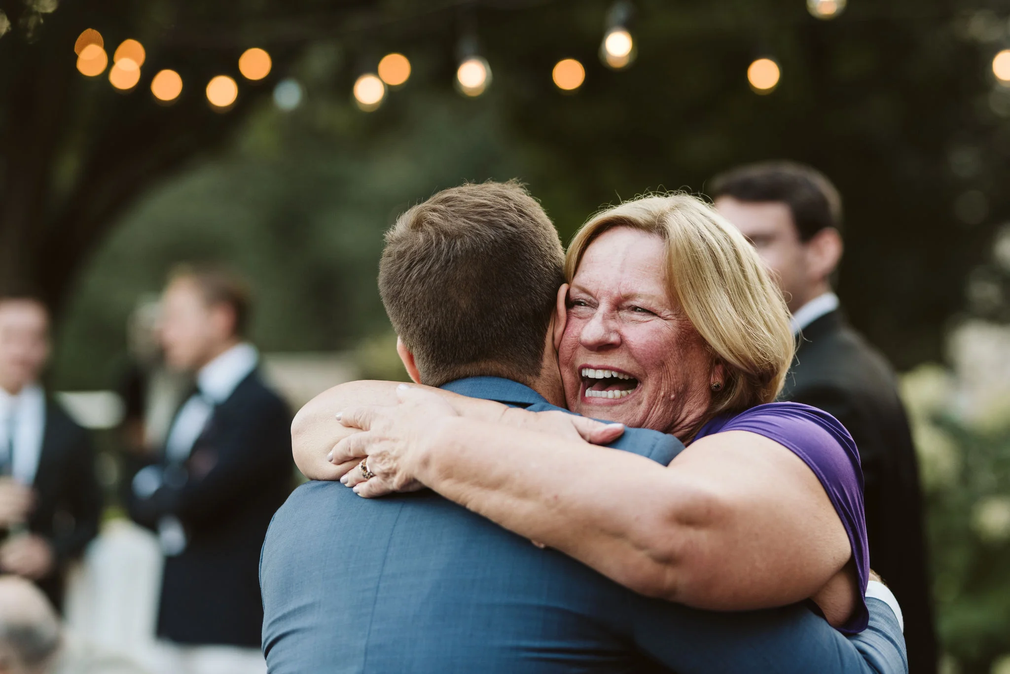 Phoenix Maryland, Baltimore Wedding Photographer, Eagle’s Nest Country Club, Classic, Romantic, Family Hugging Groom, Wedding Guests Congratulating Groom