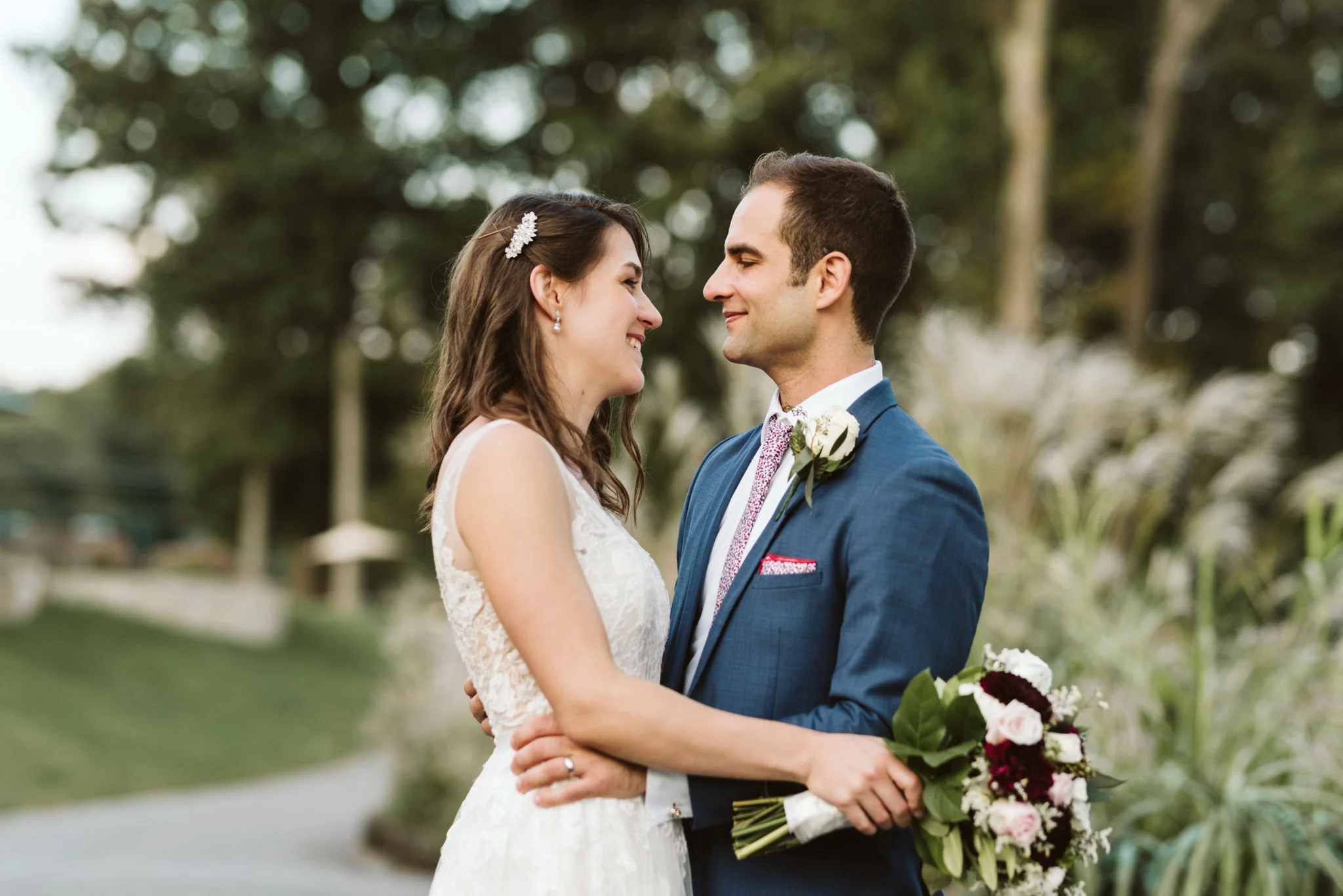 Phoenix Maryland, Baltimore Wedding Photographer, Eagle’s Nest Country Club, Classic, Romantic, Bride and Groom Looking Into Each Other’s Eyes, Generation Tux Blue Suit, Dundalk Florist