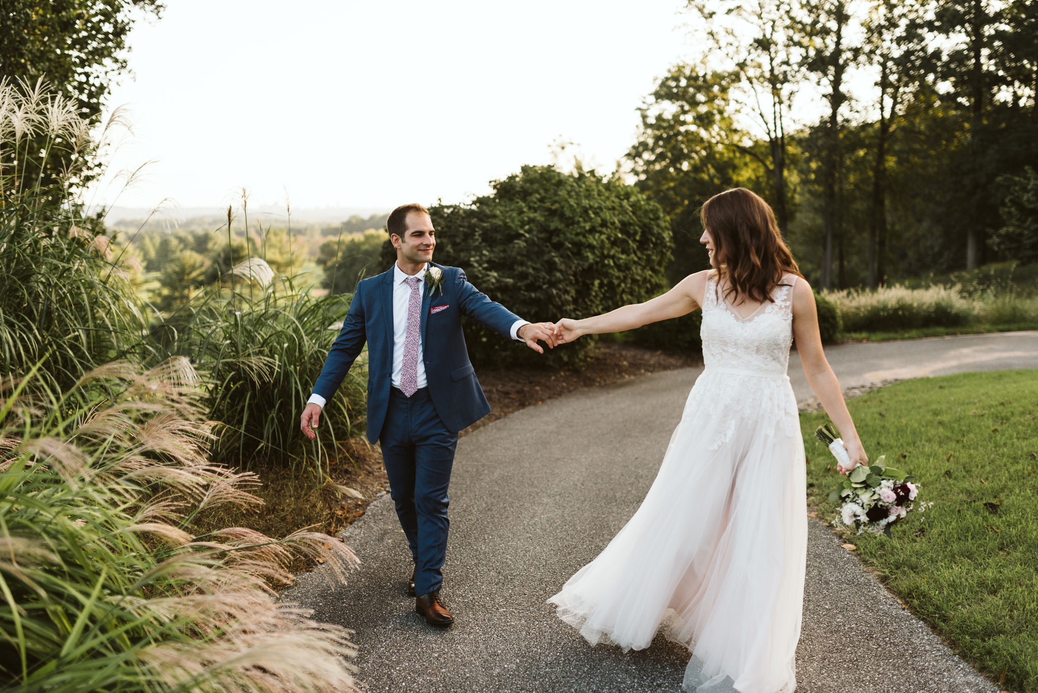  Phoenix Maryland, Baltimore Wedding Photographer, Eagle’s Nest Country Club, Classic, Romantic, Couple Holding Hands on Nature Path, BHLDN Dress, Blue Suit from Generation Tux 