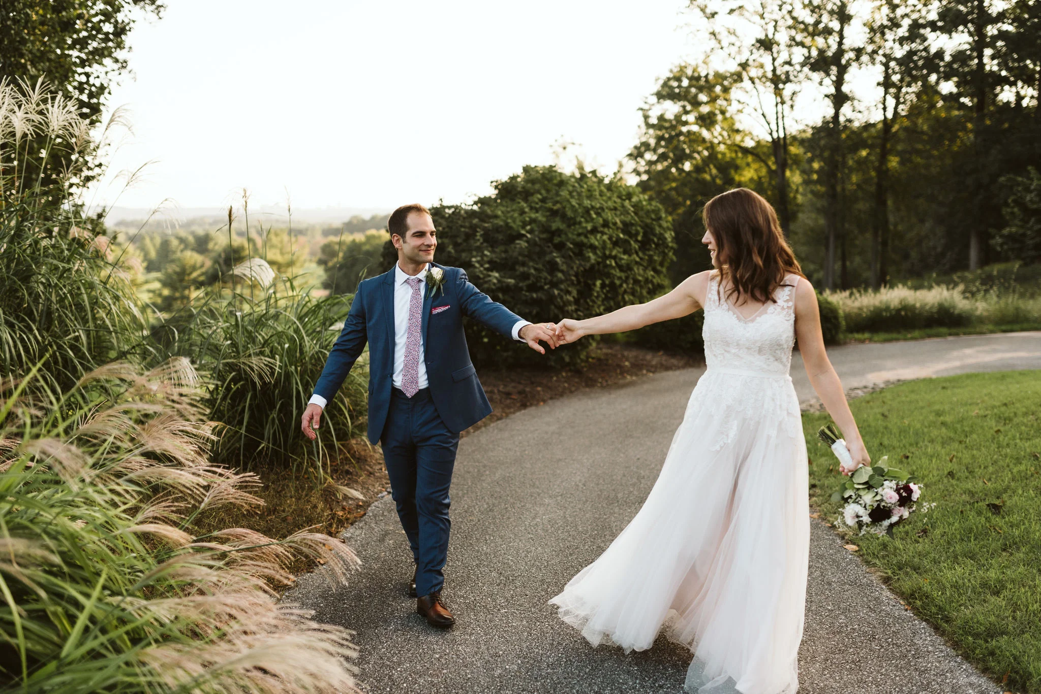 Phoenix Maryland, Baltimore Wedding Photographer, Eagle’s Nest Country Club, Classic, Romantic, Couple Holding Hands on Nature Path, BHLDN Dress, Blue Suit from Generation Tux