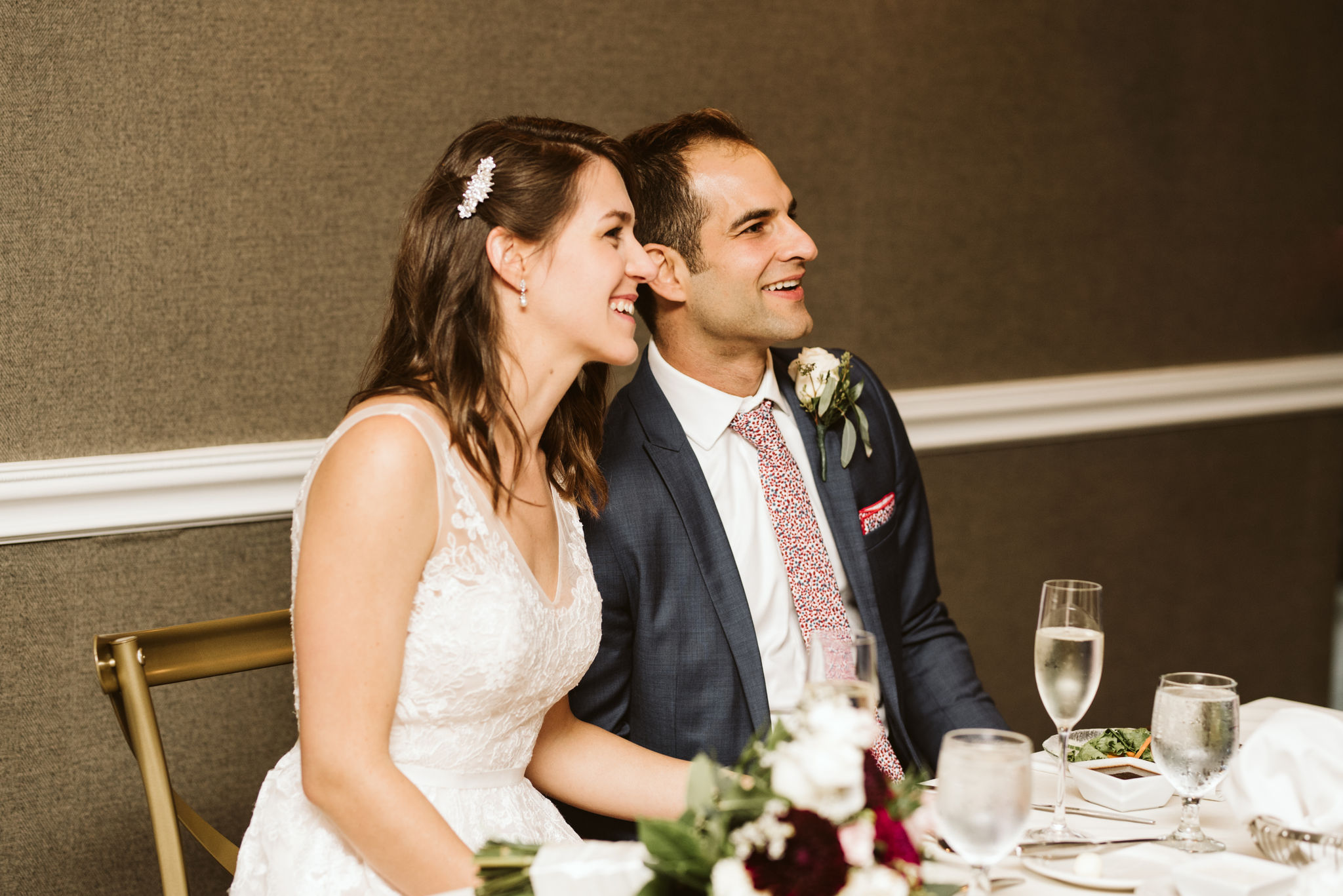  Phoenix Maryland, Baltimore Wedding Photographer, Eagle’s Nest Country Club, Classic, Romantic, Spring, Bride and Groom Smiling Together at Head Table, Gaby Vinas Hair 