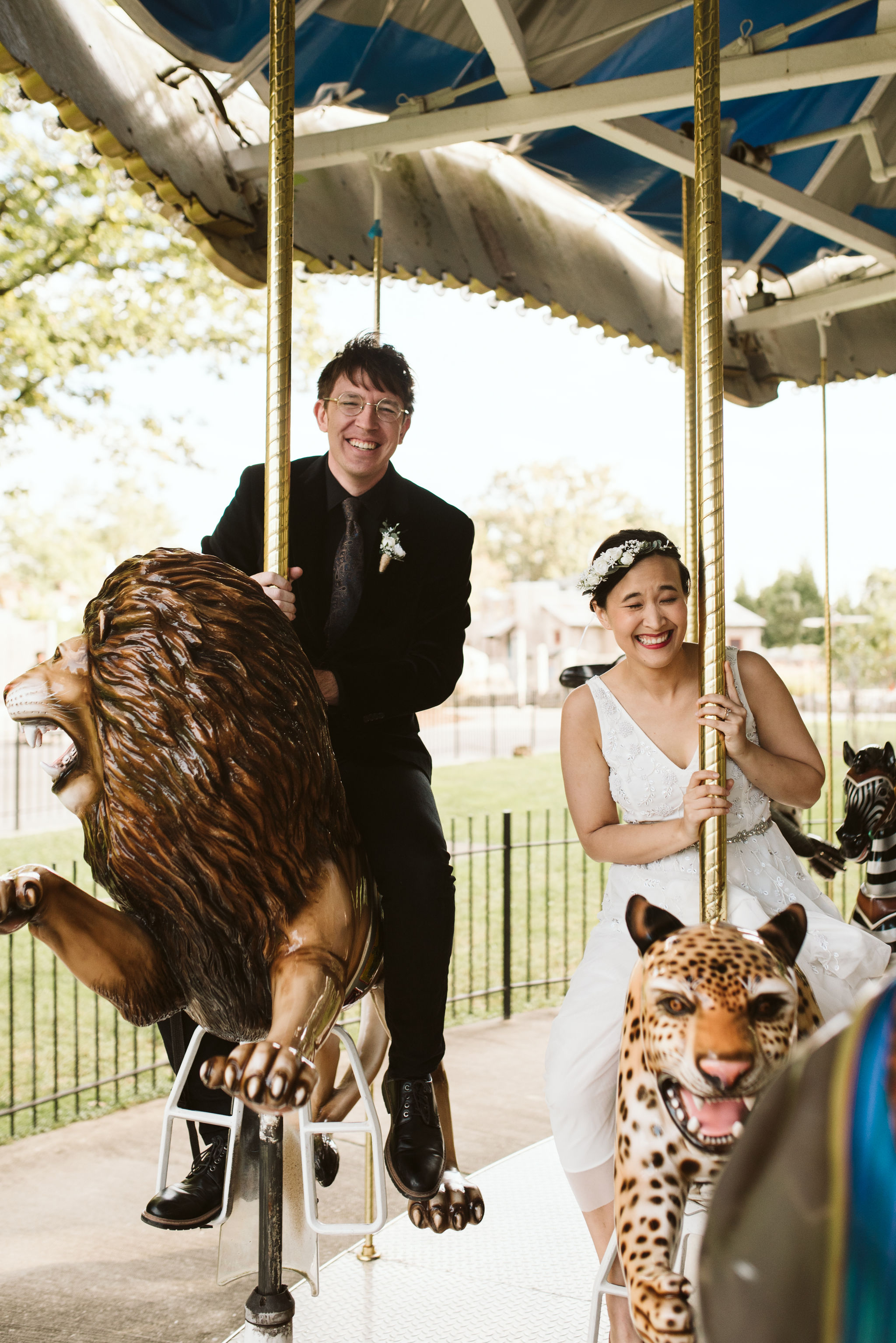  Baltimore, Maryland Wedding Photographer, The Mansion House at the Maryland Zoo, Relaxed, Romantic, Laid Back, Fun Photo of Bride and Groom on Carousel, Couple Laughing Together 