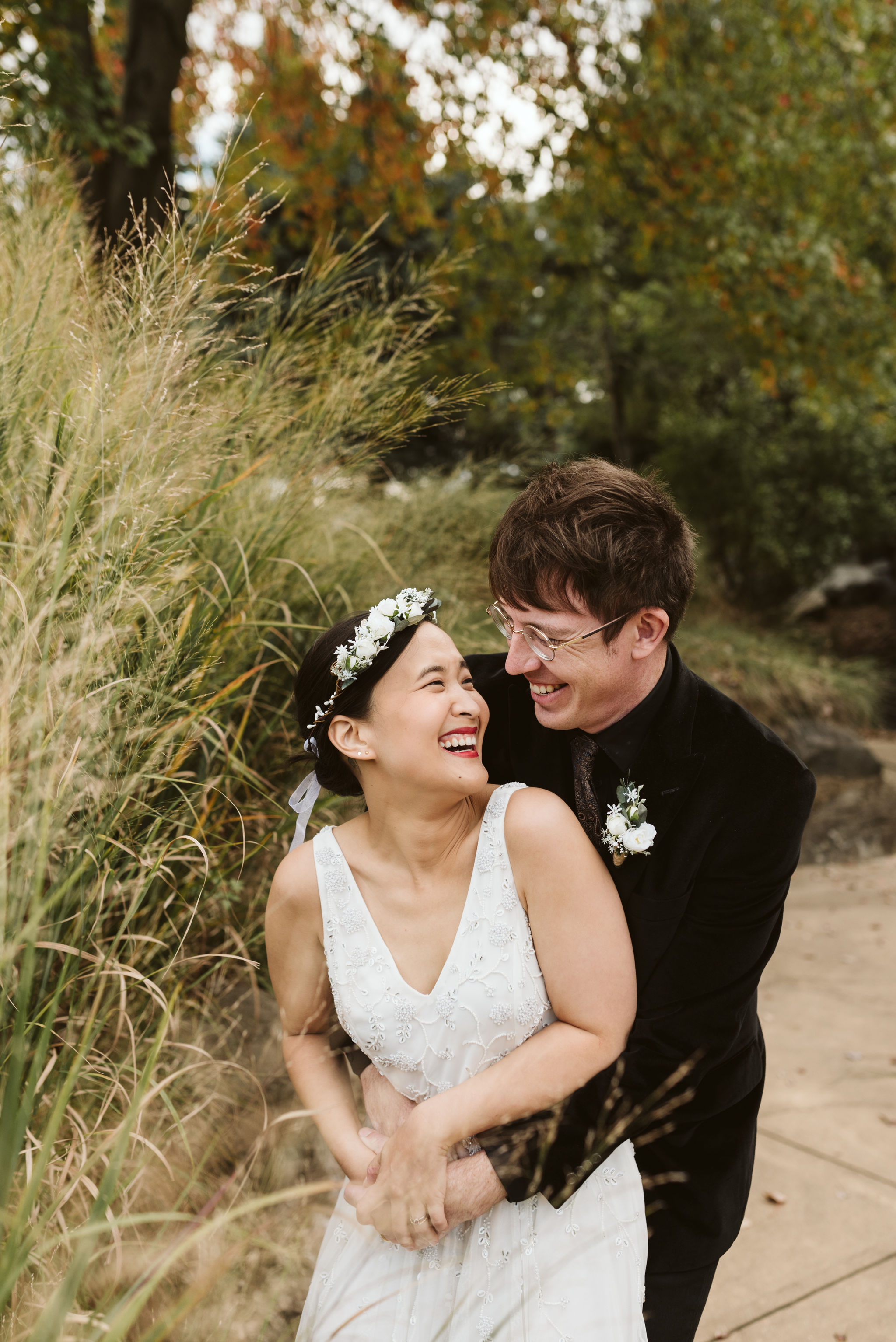  Baltimore, Maryland Wedding Photographer, The Mansion House at the Maryland Zoo, Relaxed, Romantic, Laid Back, Bride and Groom Hugging and Laughing Together, Flower Crown, Beaded Wedding Dress 