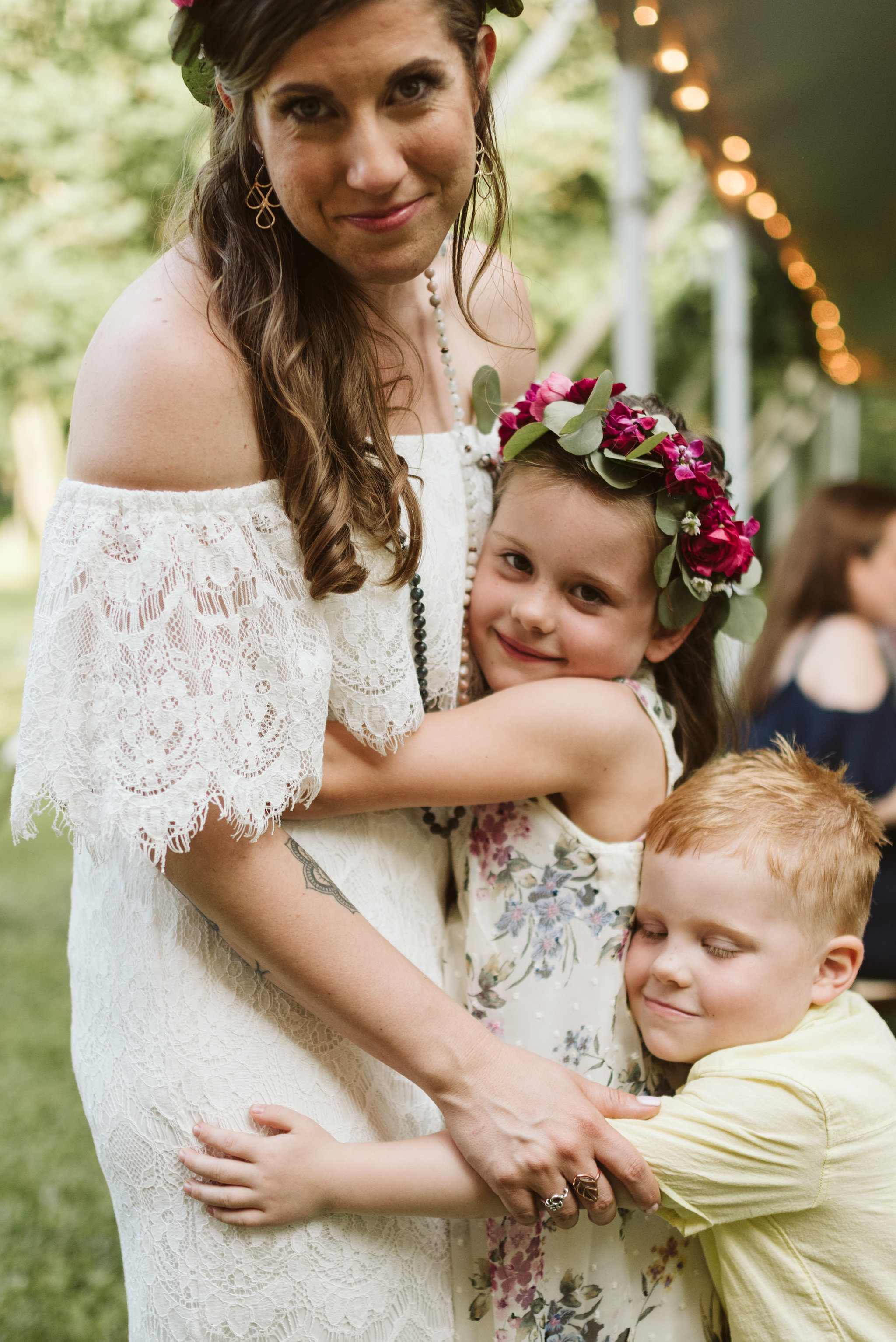 Annapolis, Quaker Wedding, Maryland Wedding Photographer, Intimate, Small Wedding, Vintage, DIY, Bride Hugging Kids at Reception, Sweet Photo of Bride with Children