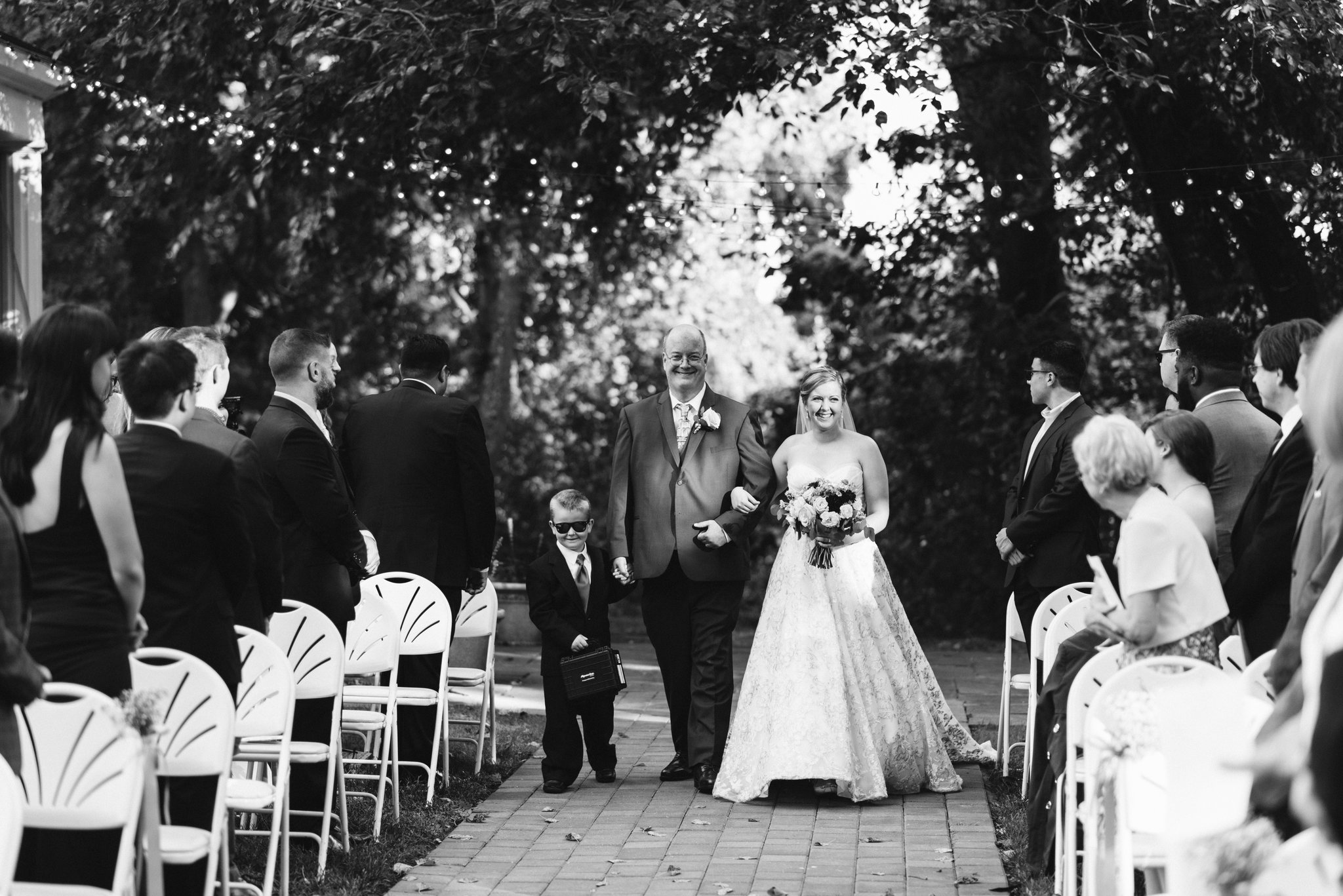  Ellicott City, Baltimore Wedding Photographer, Wayside Inn, Summer Wedding, Romantic, Traditional, Bride Walking Down Aisle with Father of the Bride and Ring Bearer, Black and White Photo 