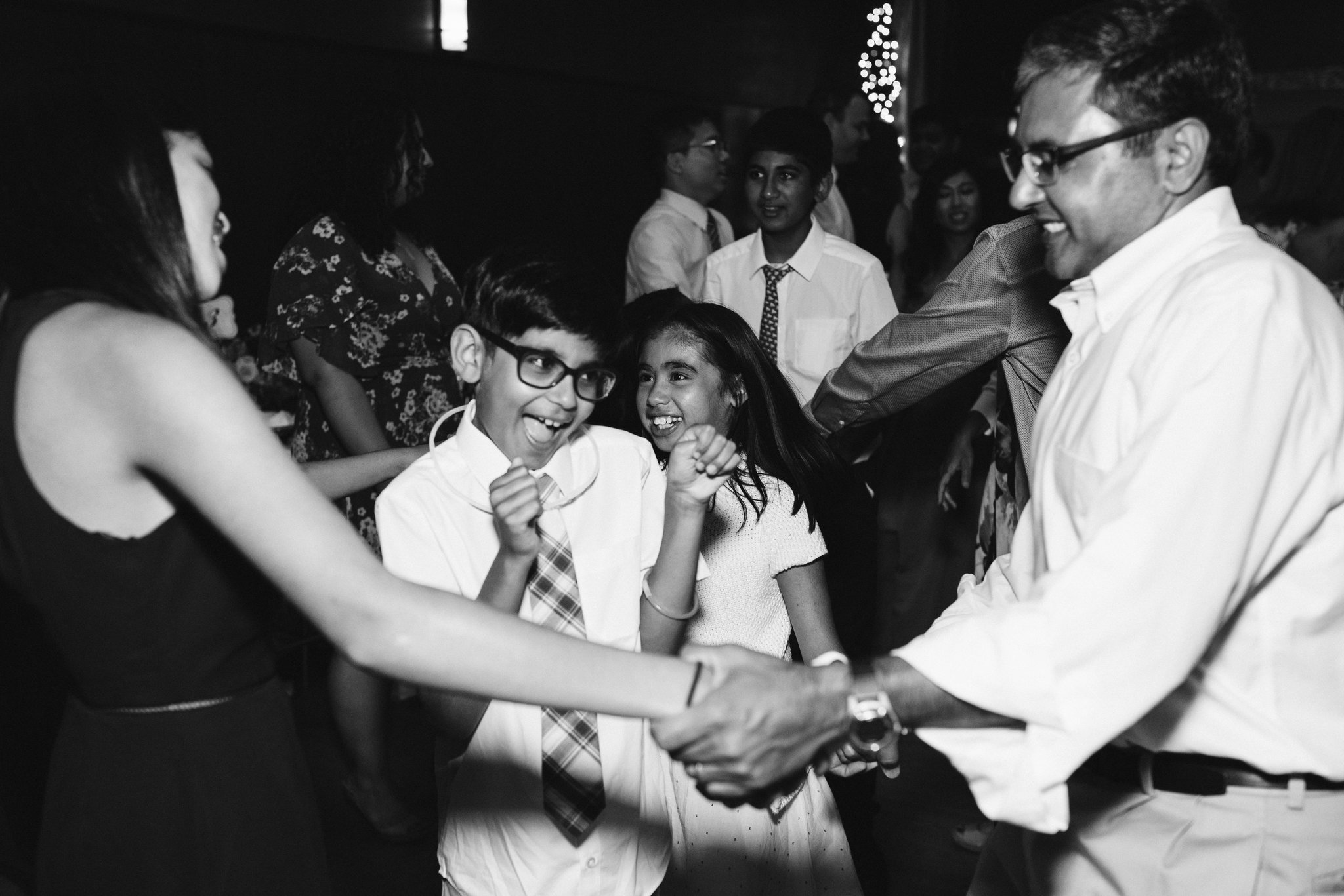  Ellicott City, Baltimore Wedding Photographer, Wayside Inn, Summer Wedding, Romantic, Traditional, Wedding Guests Singing and Dancing at Reception, Black and White Photo 