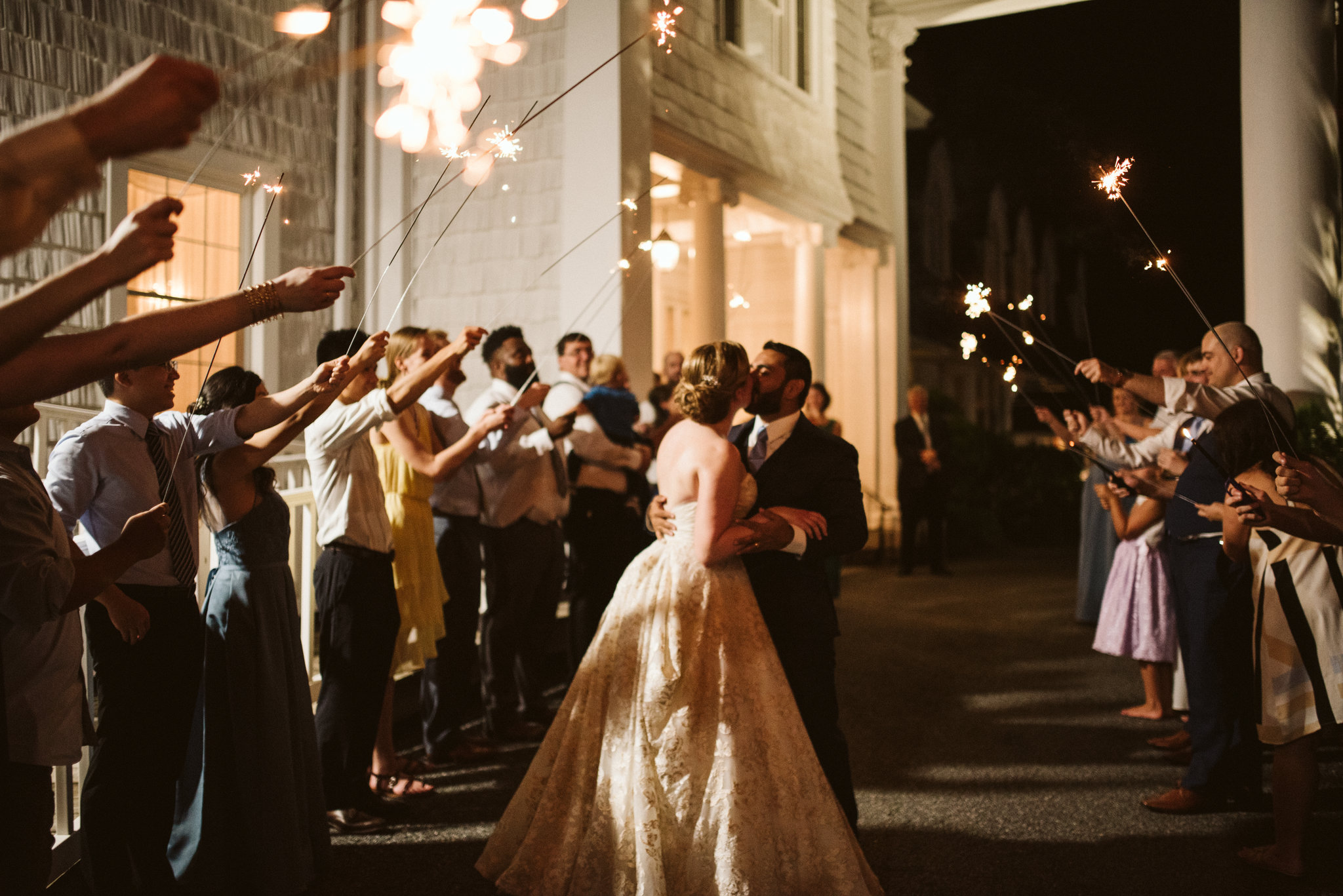  Ellicott City, Baltimore Wedding Photographer, Wayside Inn, Summer Wedding, Romantic, Traditional, Bride and groom Kissing Surrounded by Sparklers Outside Venue 