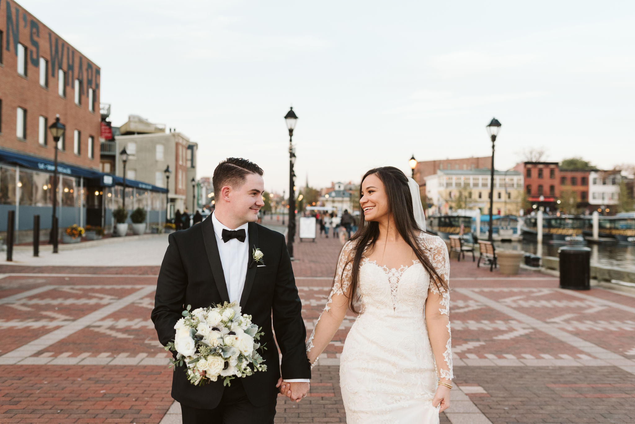  Baltimore, Fells Point, Maryland Wedding Photographer, Winter Wedding, Historic, Classic, Vintage, Bride and Groom Laughing Together Downtown, Lace Wedding Dress, Nutmeg Flowers 