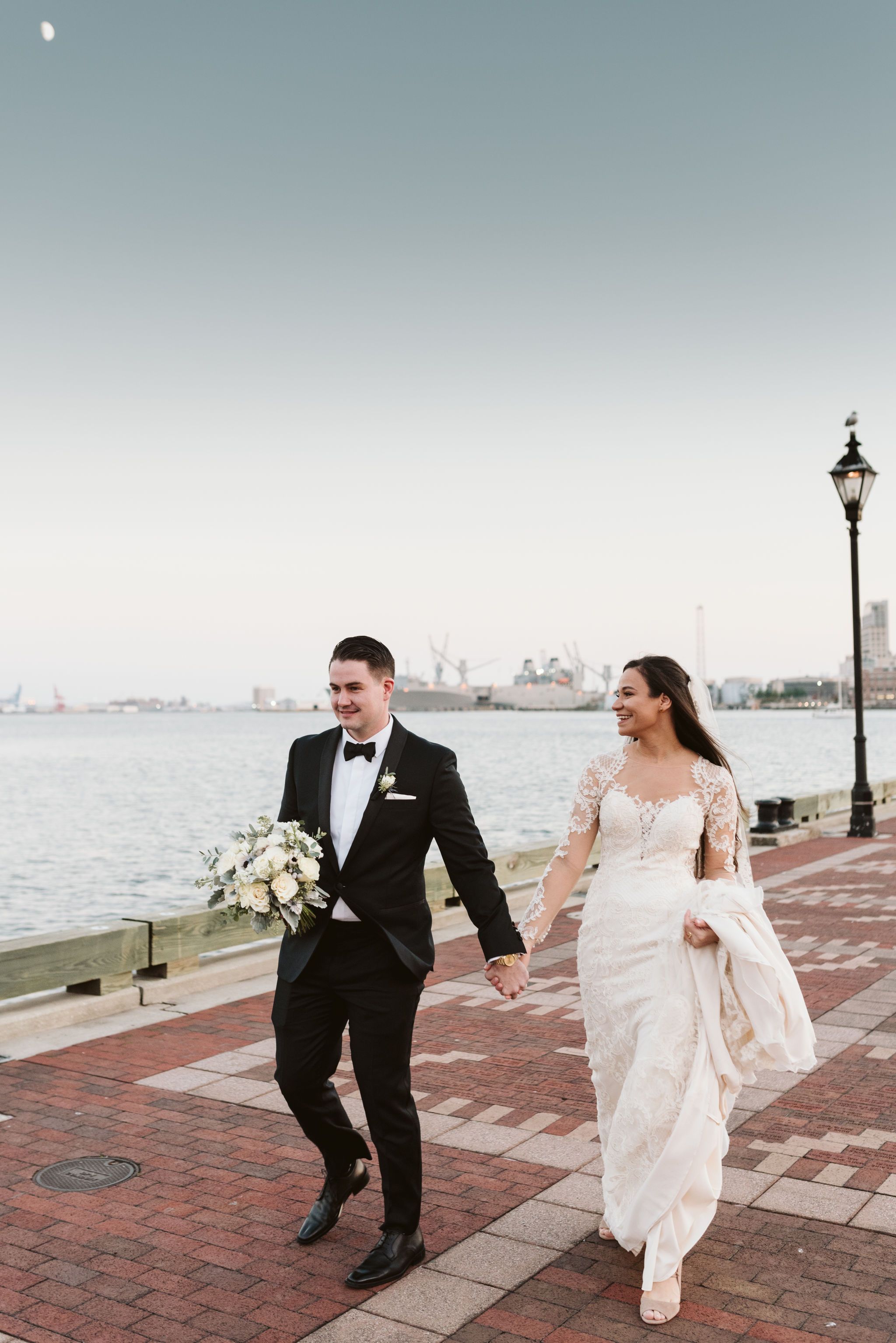  Baltimore, Fells Point, Maryland Wedding Photographer, Winter Wedding, Historic, Classic, Vintage, Bride and Groom Walking on Cobblestone Street, Inner Harbor, Lace Wedding Dress 