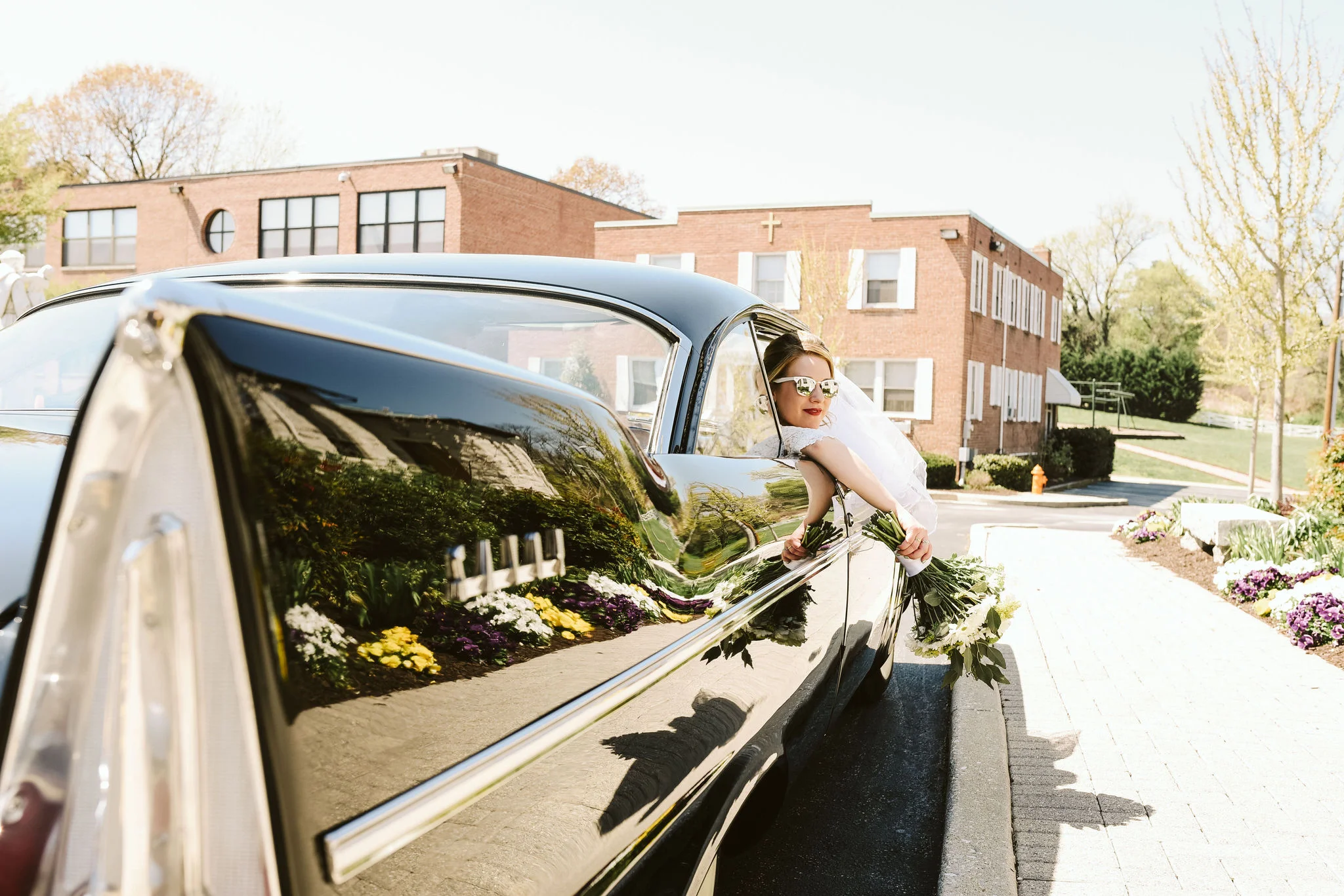Baltimore, Church Wedding, Maryland Wedding Photographer, Vintage, Classic, 50s Style, Bride Leaning Out Window of Classic Car, White Sunglasses, Baltimore City