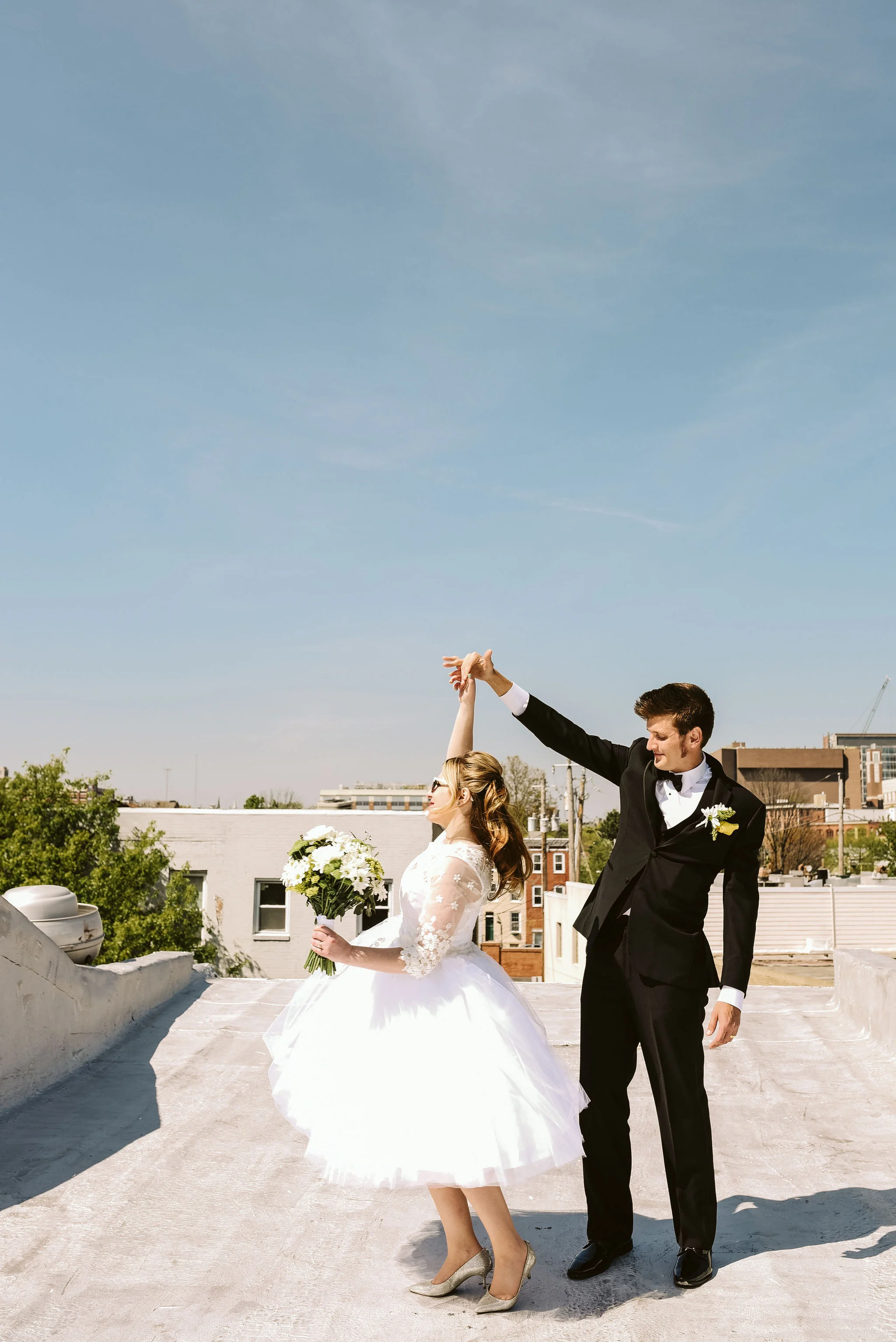 Baltimore, Church Wedding, Maryland Wedding Photographer, Vintage, Classic, 50s Style, Groom Twirling Bride, Dancing on Rooftop, Black Suit, Lace and Tulle Wedding Dress, Outdoor