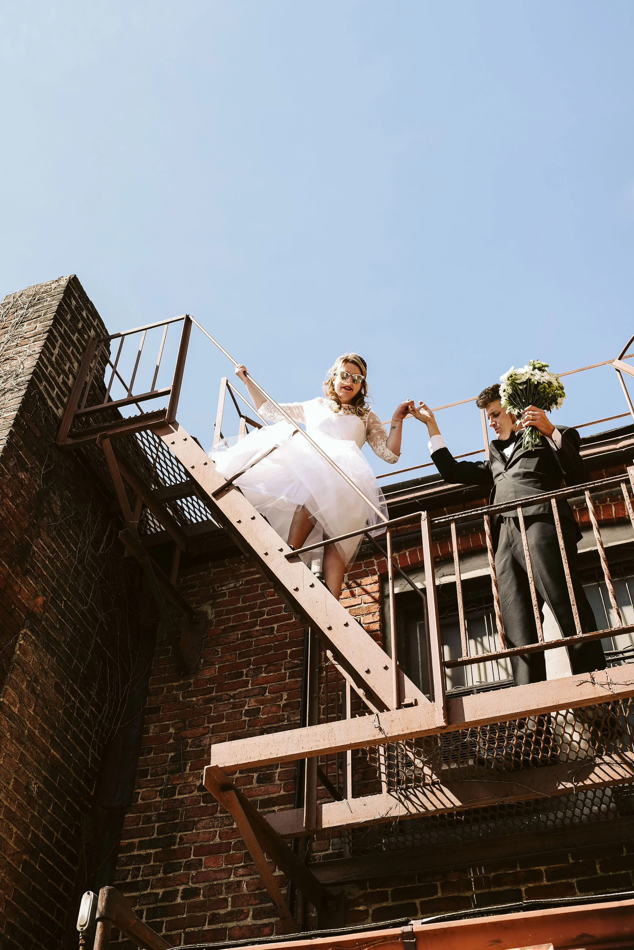 Baltimore, Church Wedding, Maryland Wedding Photographer, Vintage, Classic, 50s Style, Groom Helping Bride Down Stairs, Bride and Groom on Fire Escape, Baltimore City