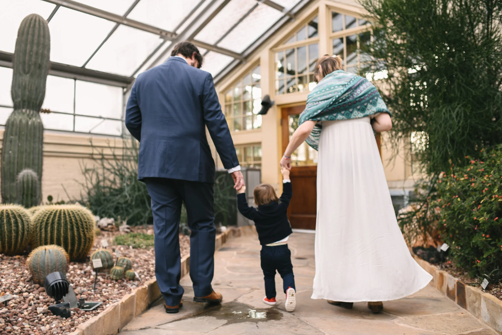 Rawlings Conservatory, Druid Hill Park, Intimate Wedding, Nature, Baltimore Wedding Photographer, Romantic, Classic, Bride and Groom Walking with Infant Son, Candid Photo