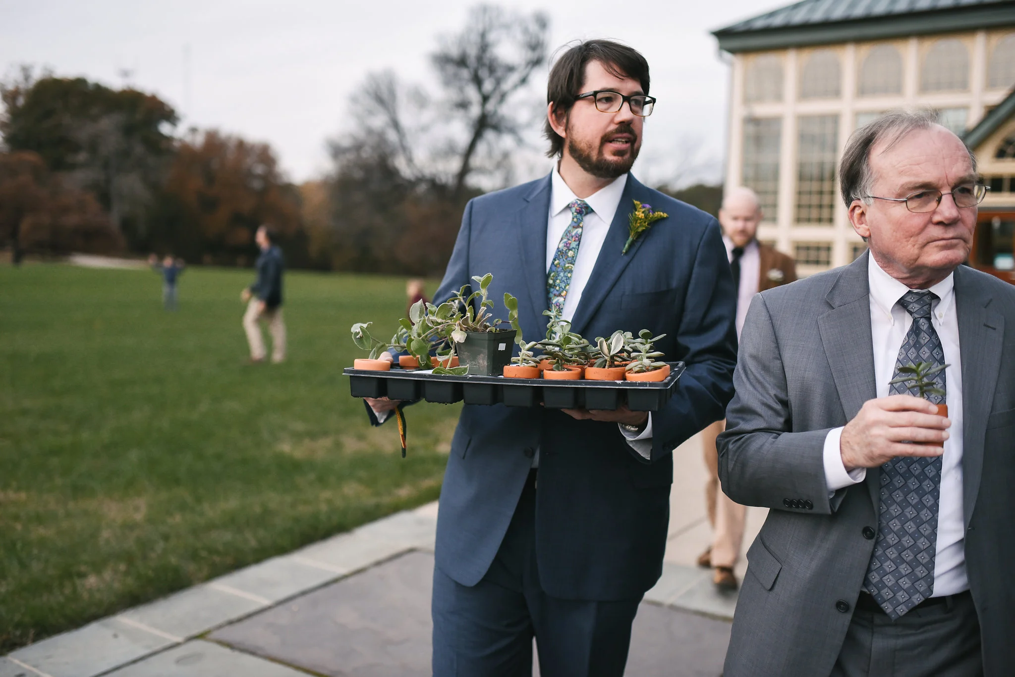 Rawlings Conservatory, Druid Hill Park, Intimate Wedding, Nature, Maryland Wedding Photographer, Romantic, Classic, Groom Walking with Succulent Wedding Favors