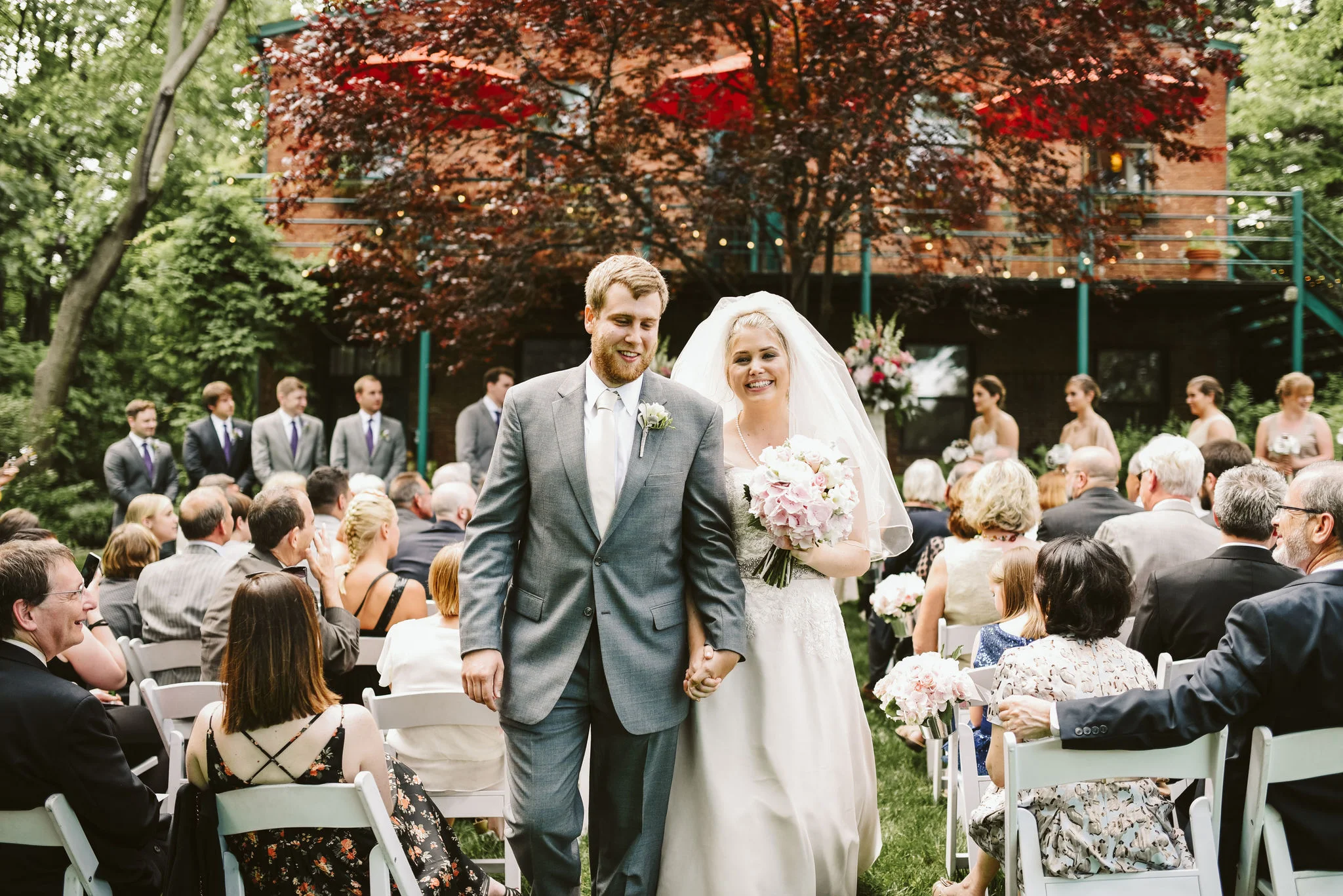 Hampden, Baltimore, Maryland Wedding Photographer, Garden Wedding, Classic, DIY, Romantic, Bride and Groom Walking Down the Aisle, Just Married, Gay Suit with White Tie, Lace Wedding Dress