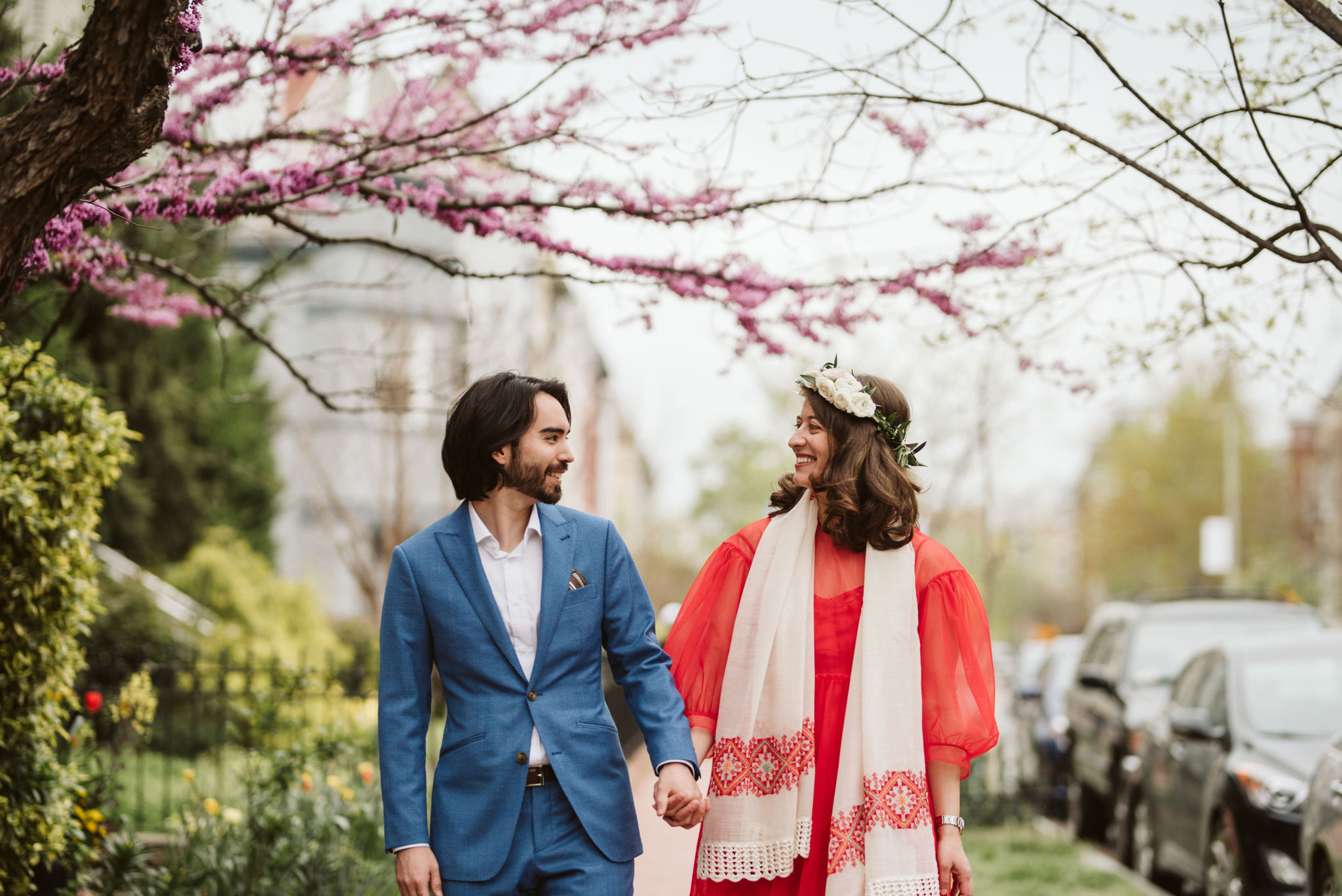  Washington DC, Baltimore Wedding Photographer, Intimate Wedding, Traditional, Classic, Palestinian, Couple Walking Hand in Hand on Sidewalk, Spring Flowers, Red Dress 