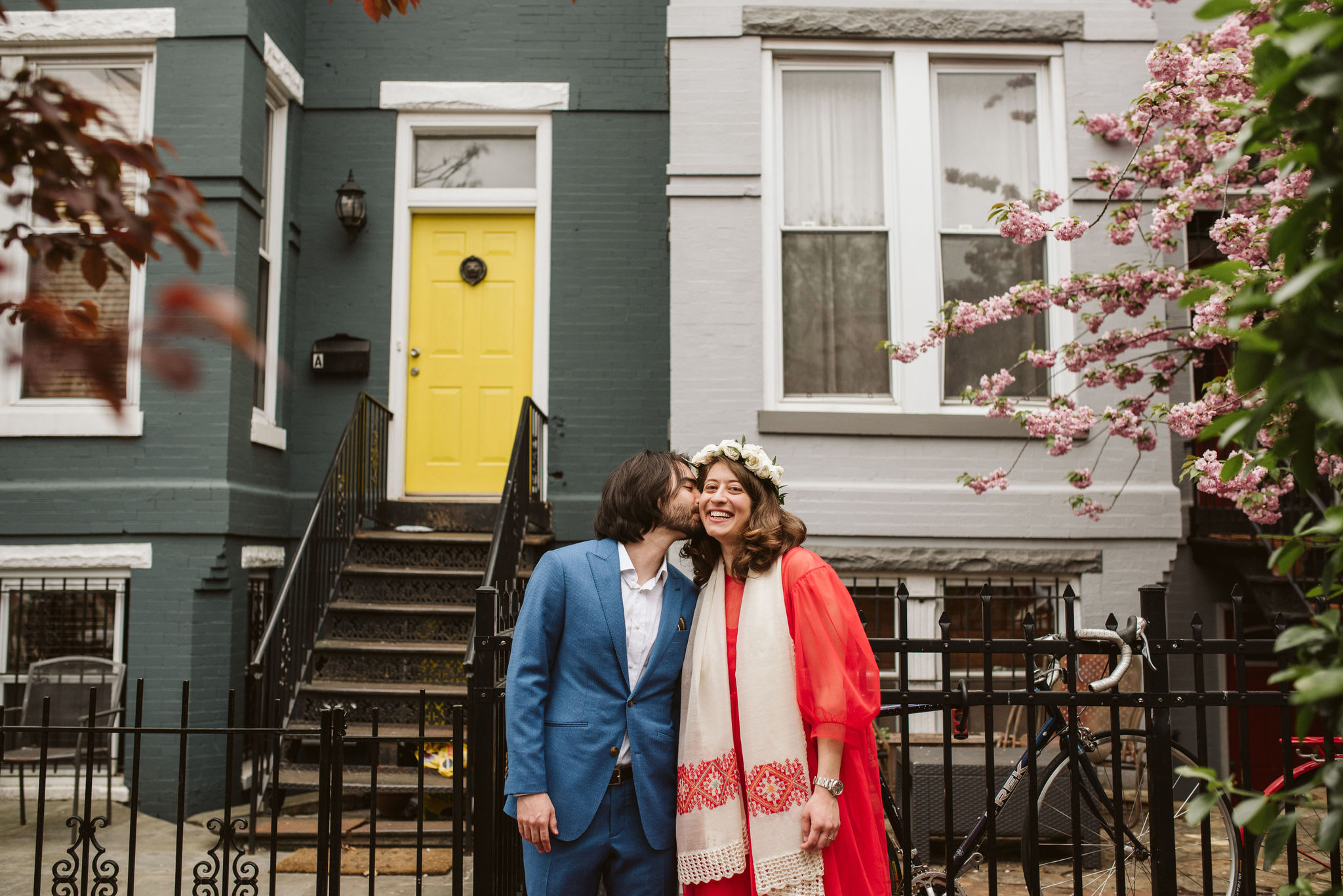  Washington DC, Baltimore Wedding Photographer, Intimate Wedding, Traditional, Classic, Palestinian, Groom Kissing Bride in Front of Rowhomes Downtown, White Rose Flower Crown 