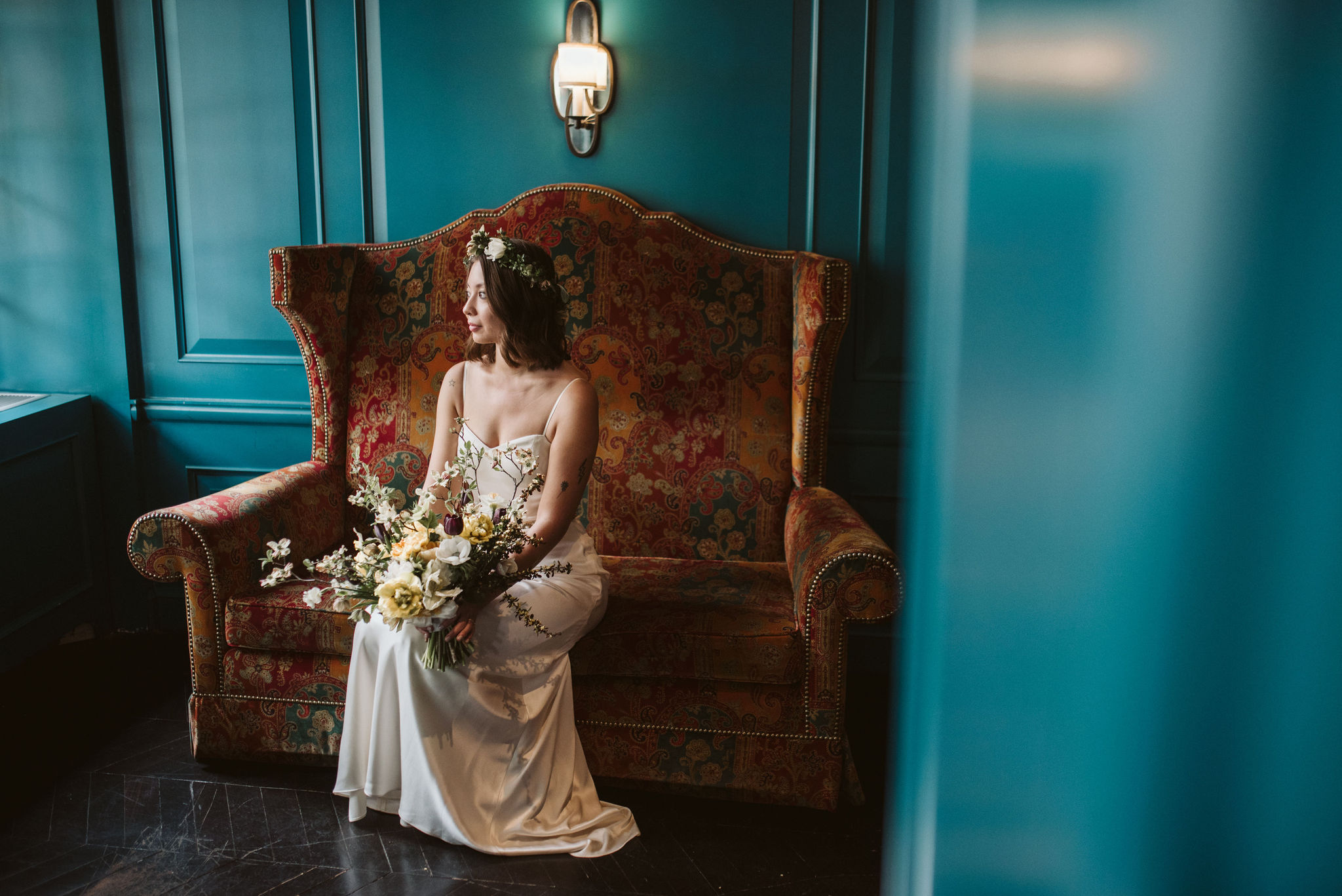  Washington DC, Baltimore Wedding Photographer, Alexandria, Old Town, Jewel Tone, Romantic, Modern, The Alexandrian Autograph Collection Hotel, Portrait of bride, Red vintage couch in front of teal wall, Sungold Flower Co 